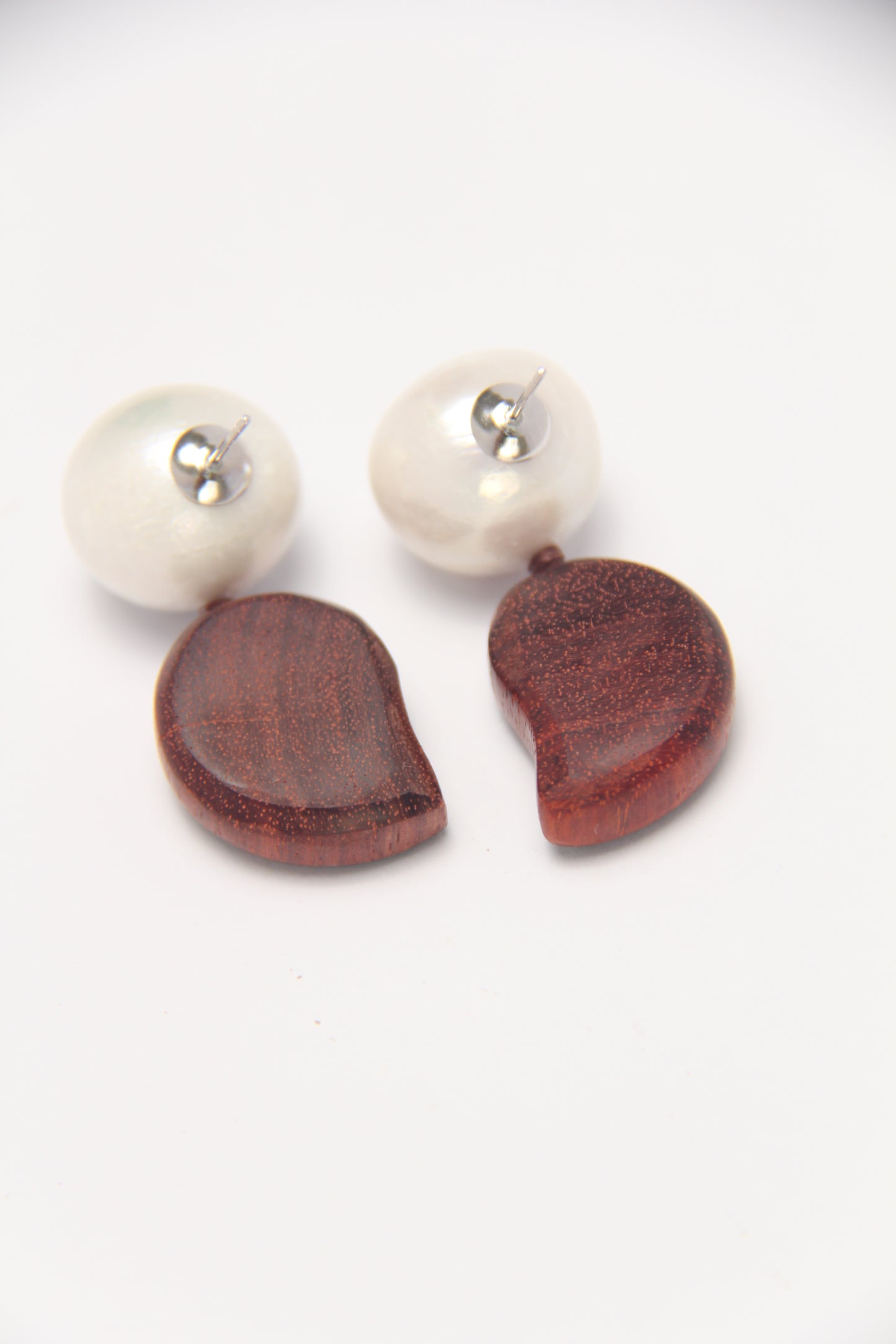 Earrings: pearls, zambia rosewood