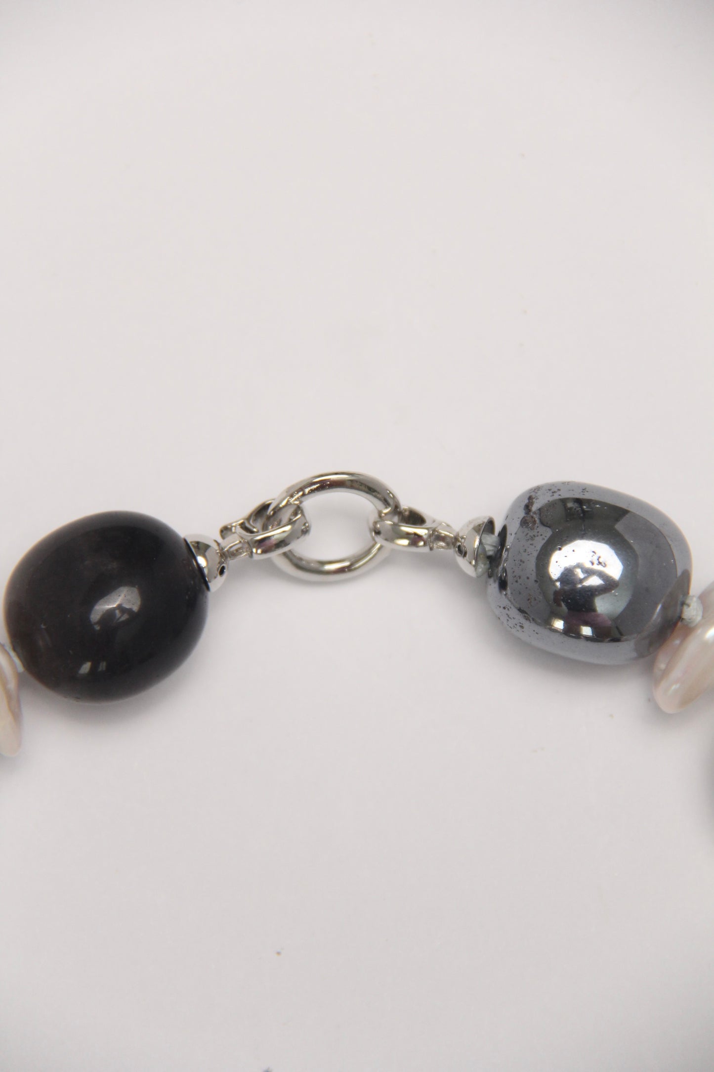 Necklace: herkimer diamond, kiwi stone, obsidian, quartz, moonstone, titanium magnet