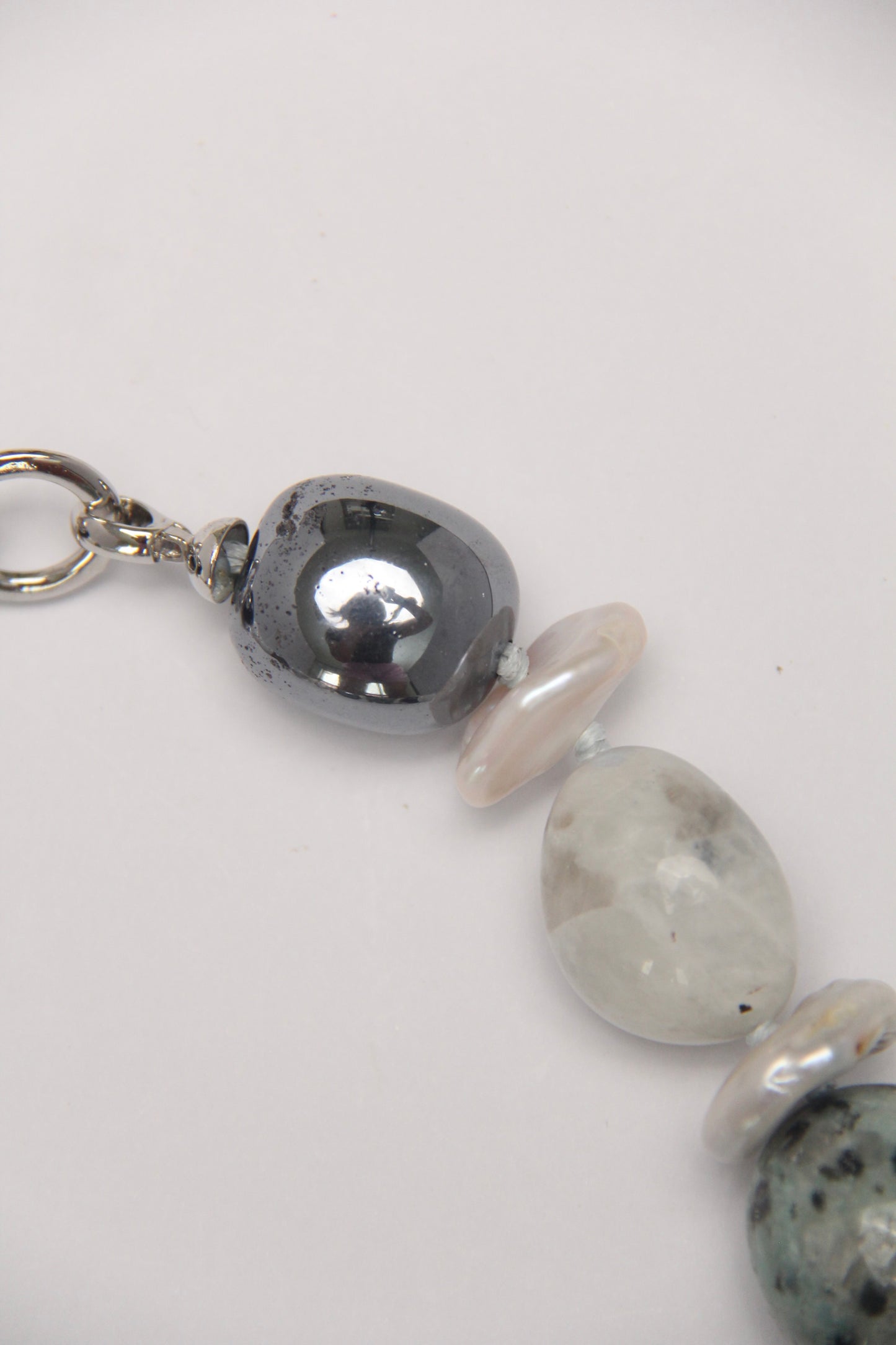 Necklace: herkimer diamond, kiwi stone, obsidian, quartz, moonstone, titanium magnet