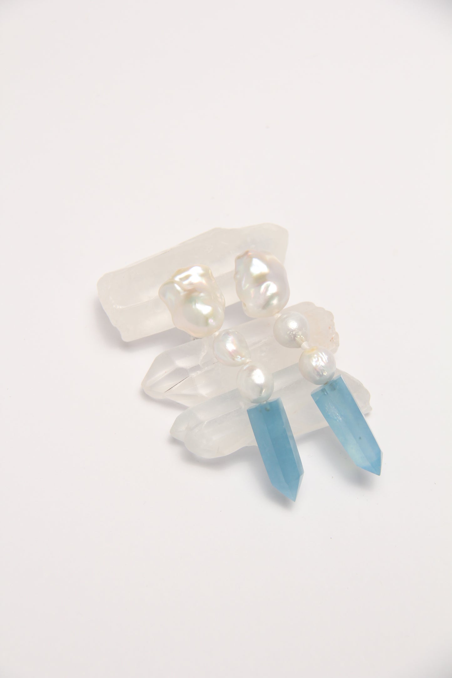 Earrings: pearls, aquamarine