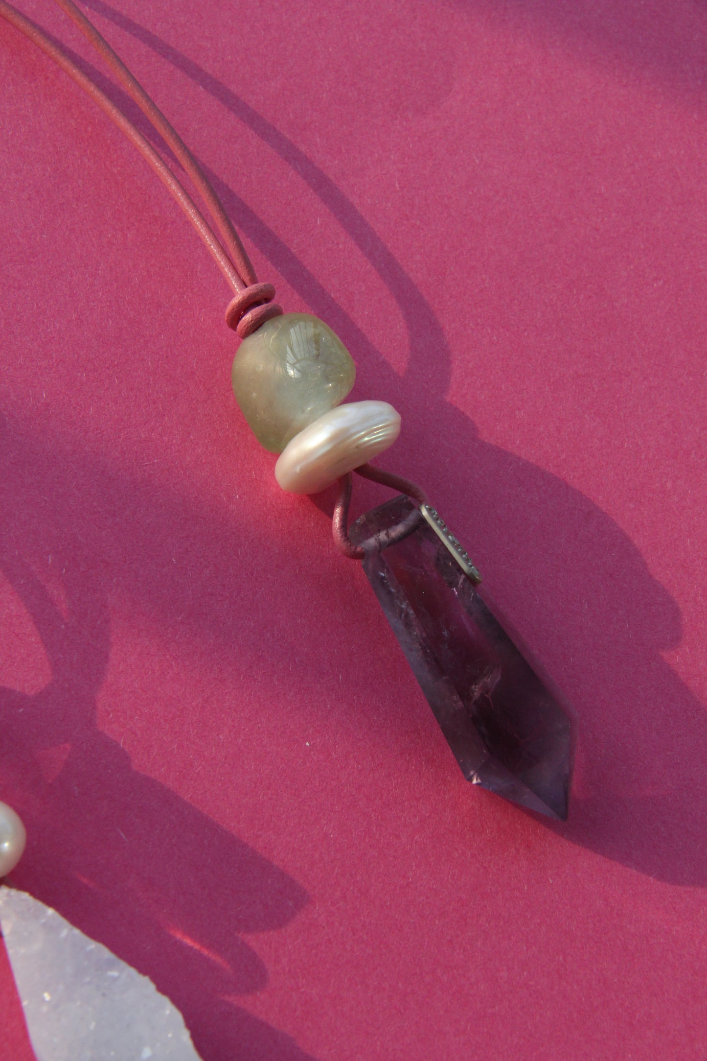 Pendant: morganite, pearl, amethyst, leather