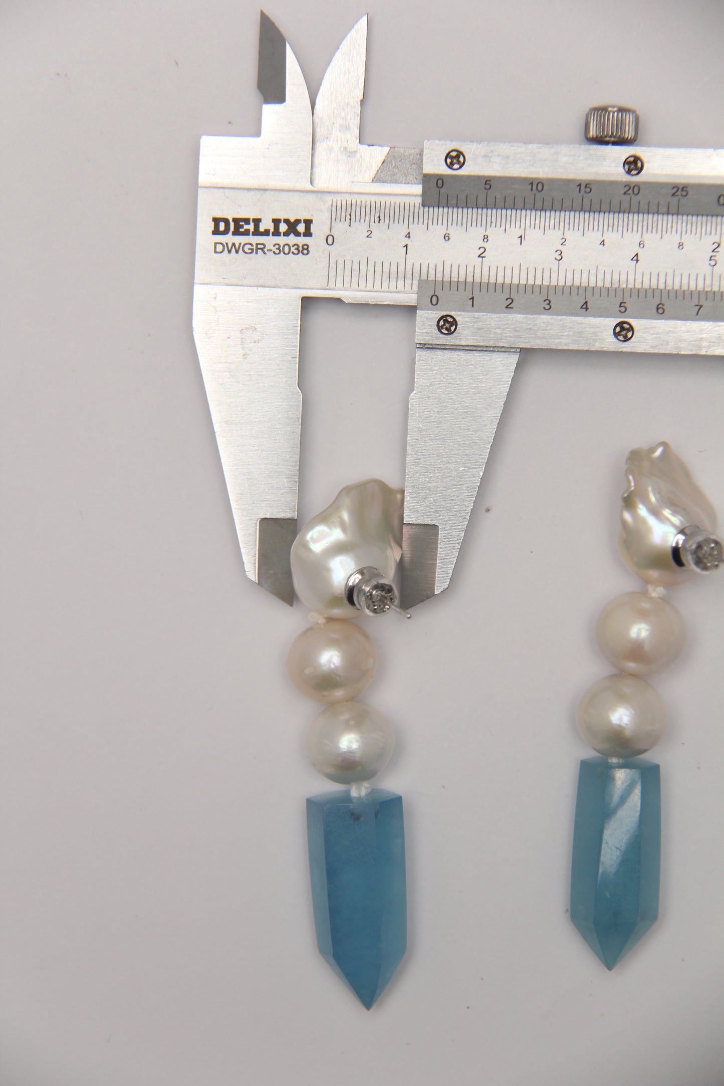 Earrings: pearls, aquamarine