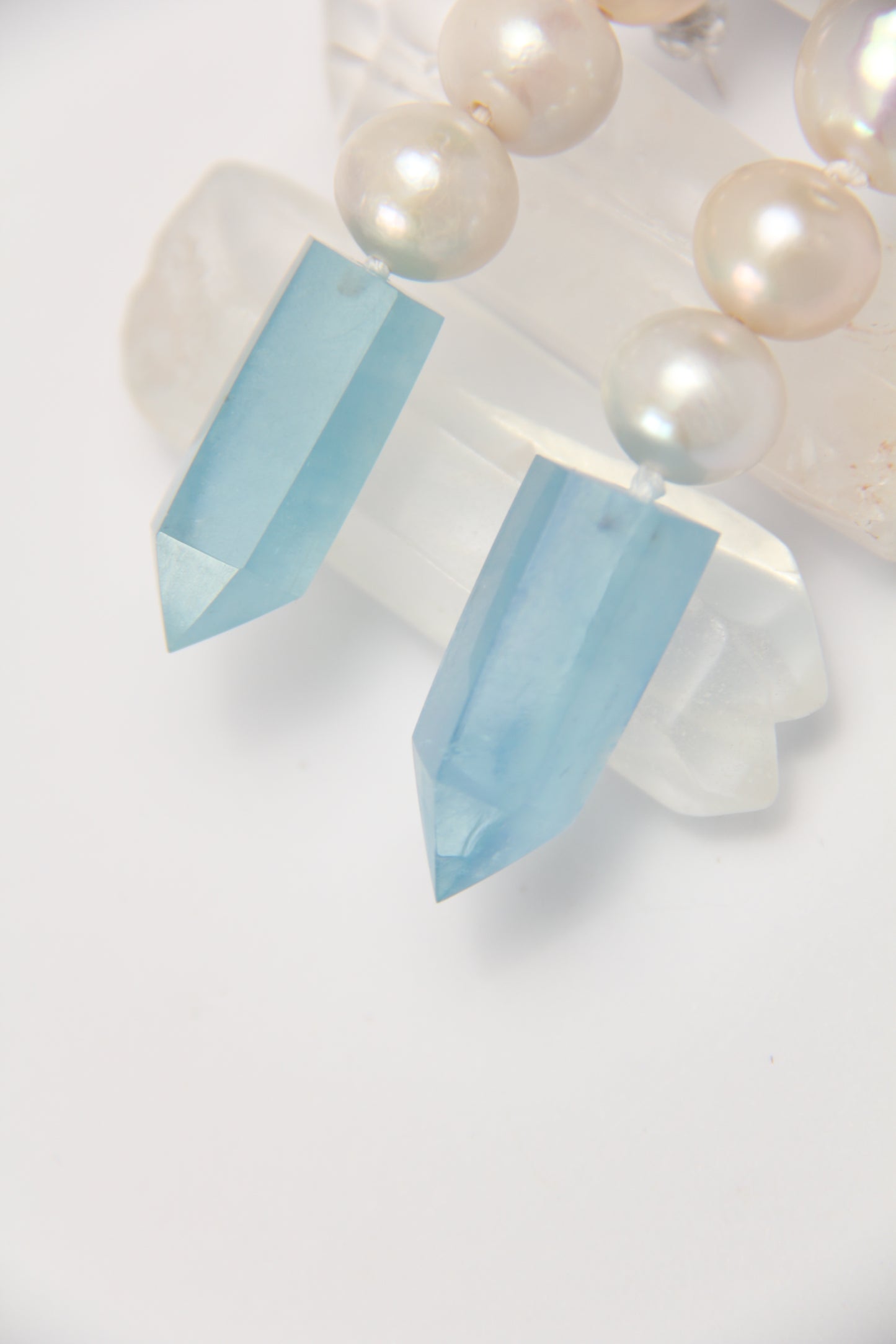 Earrings: pearls, aquamarine