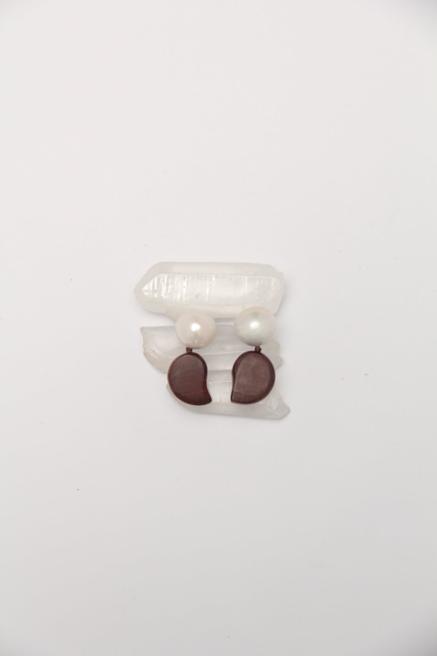 Earrings: pearls, zambia rosewood