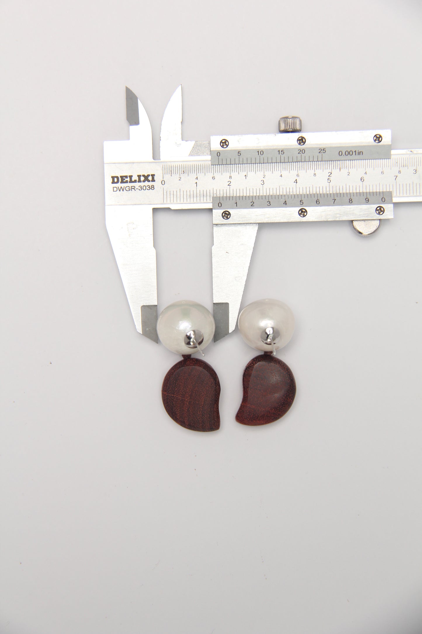Earrings: pearls, zambia rosewood
