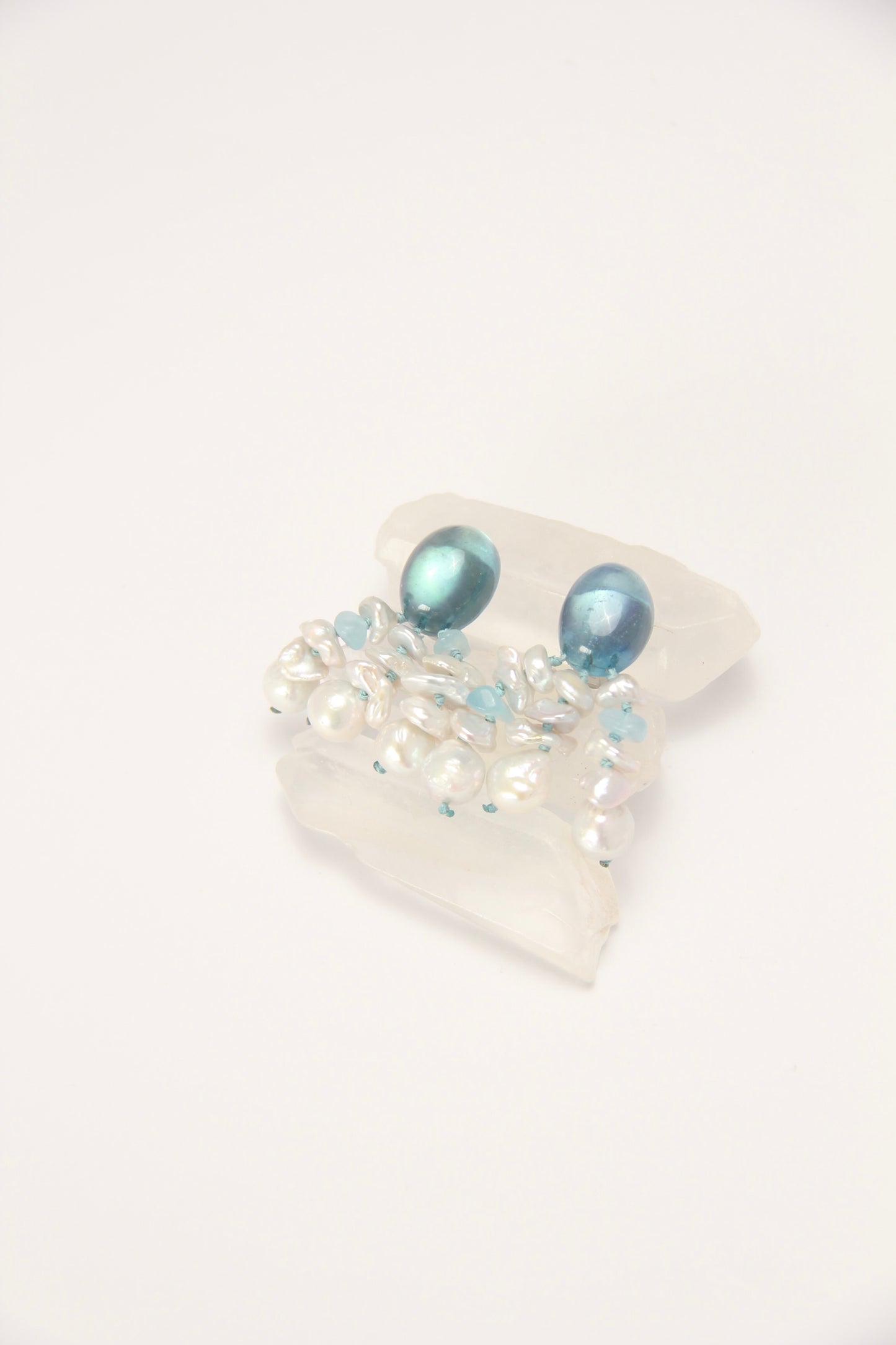 Earrings: pearls, aquamarine
