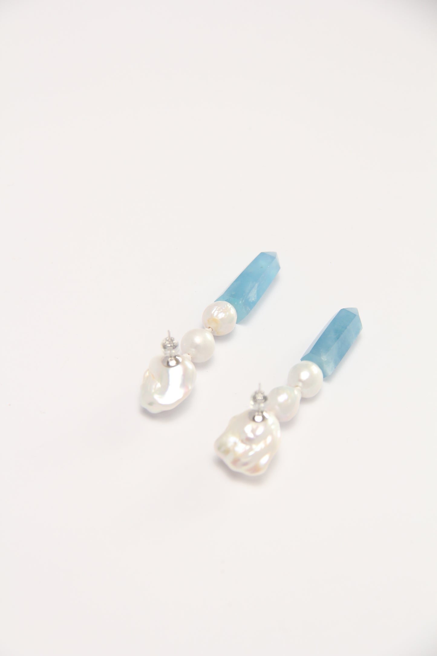 Earrings: pearls, aquamarine