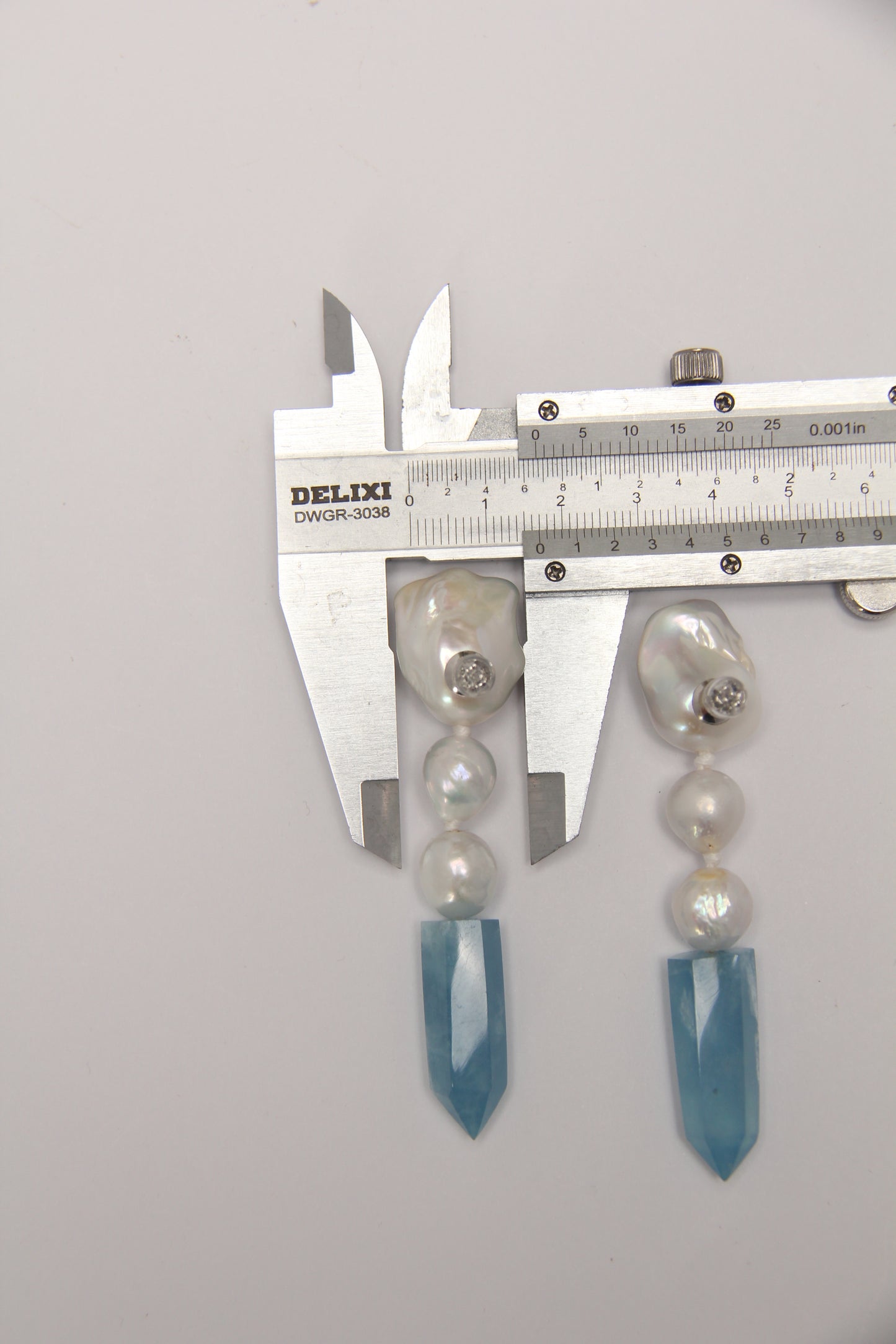 Earrings: pearls, aquamarine