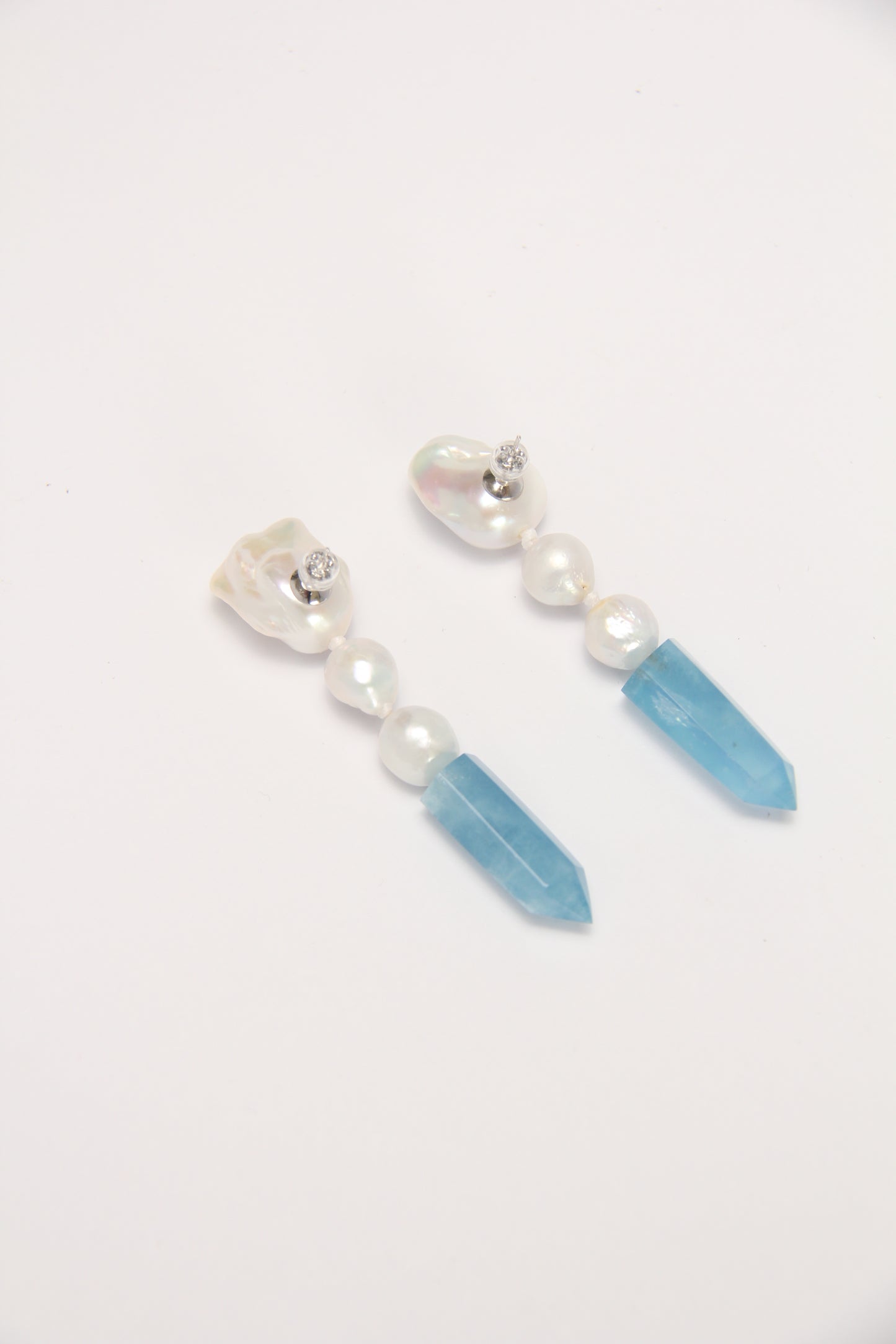 Earrings: pearls, aquamarine