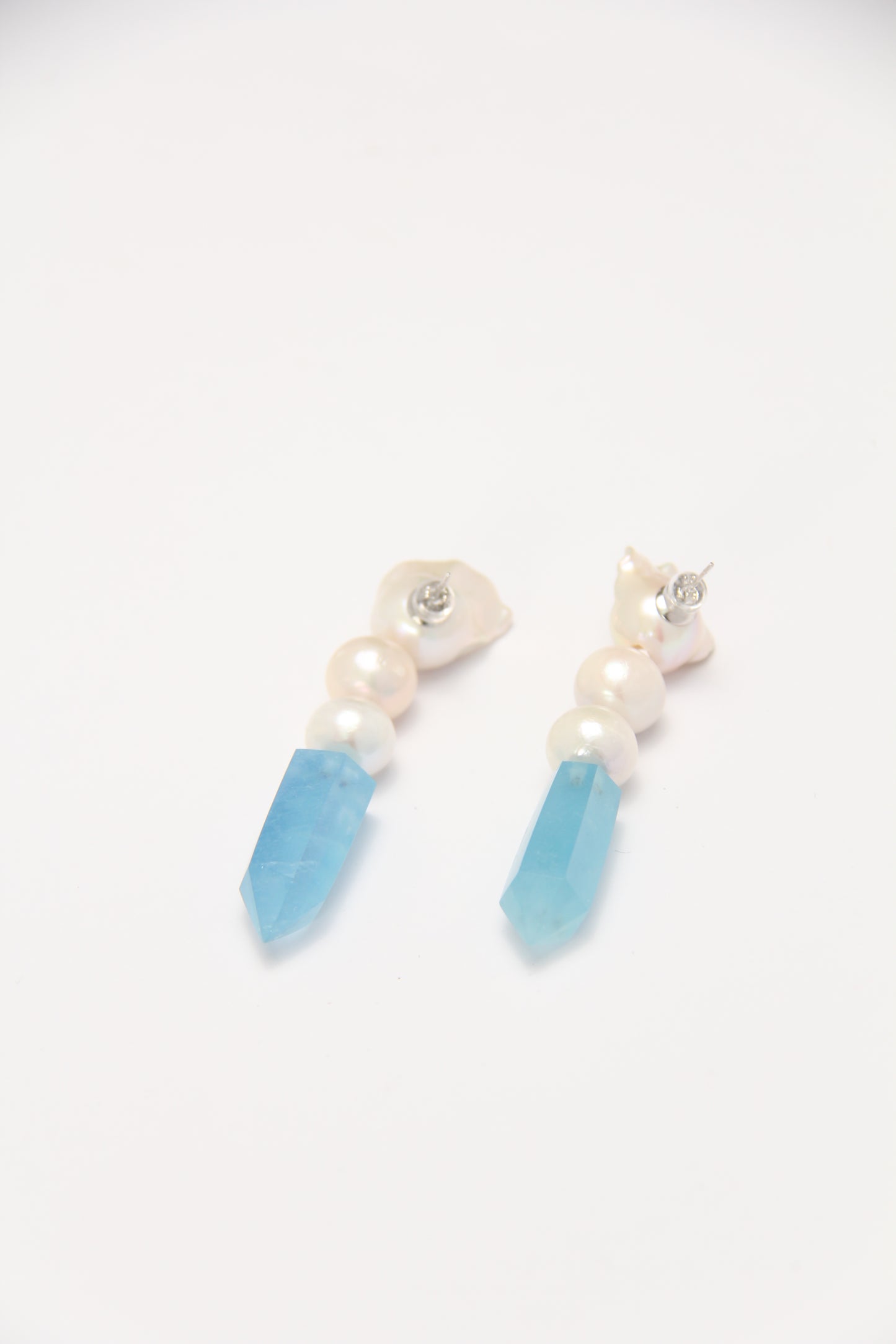 Earrings: pearls, aquamarine
