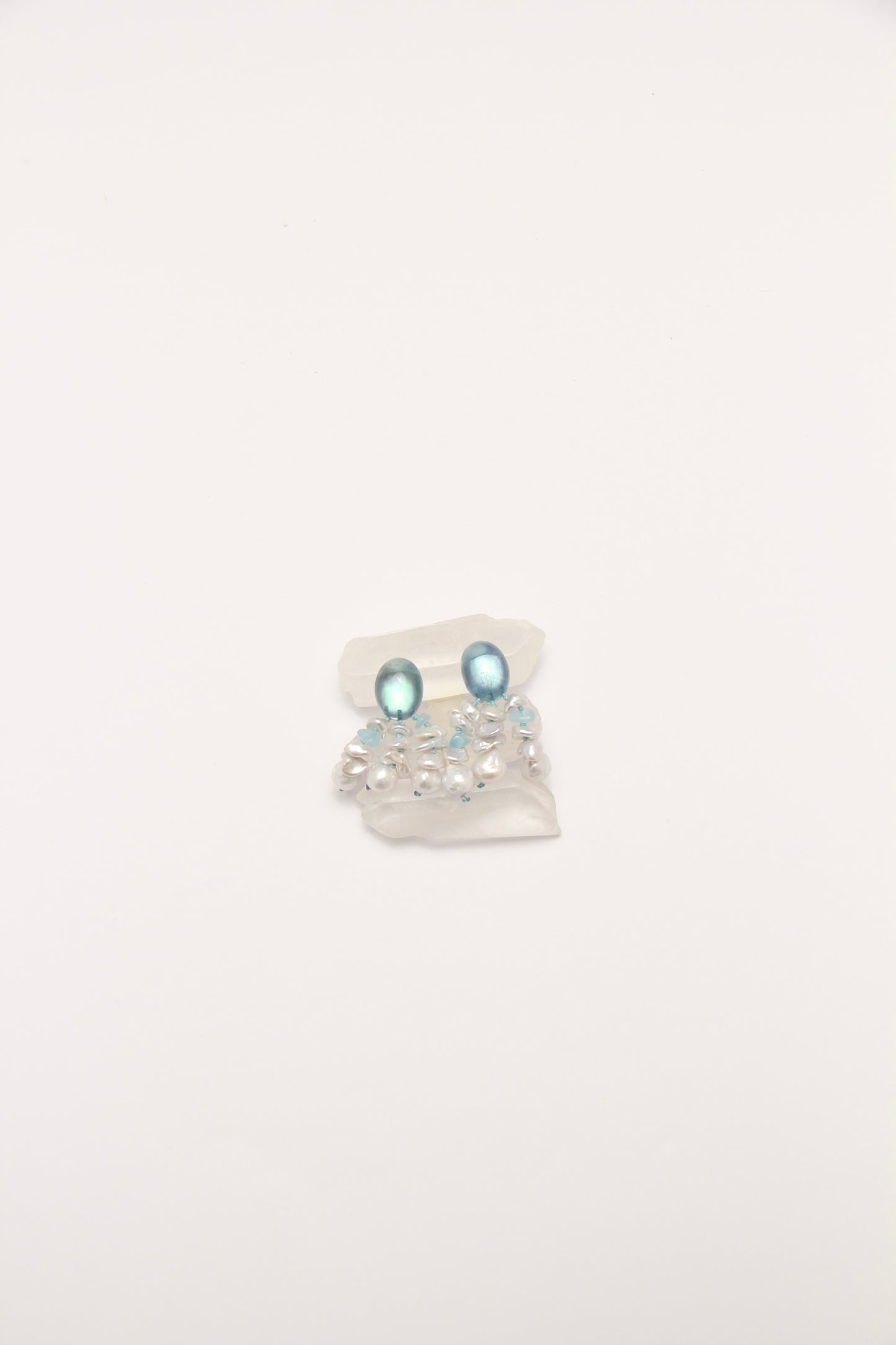 Earrings: pearls, aquamarine