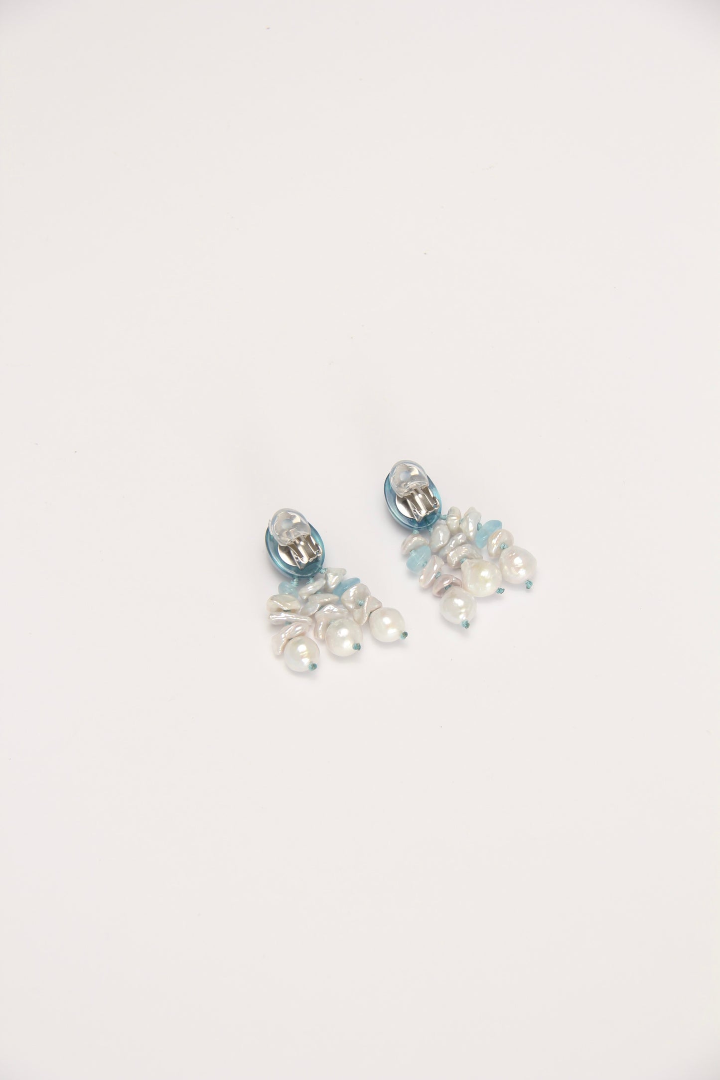 Earrings: pearls, aquamarine