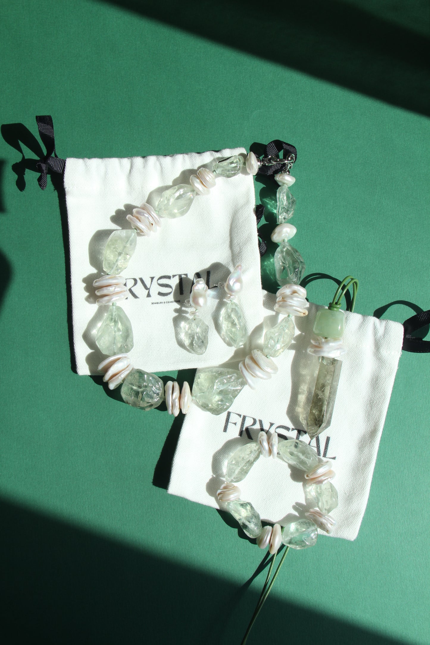 Earrings: pearls, prasem quartz