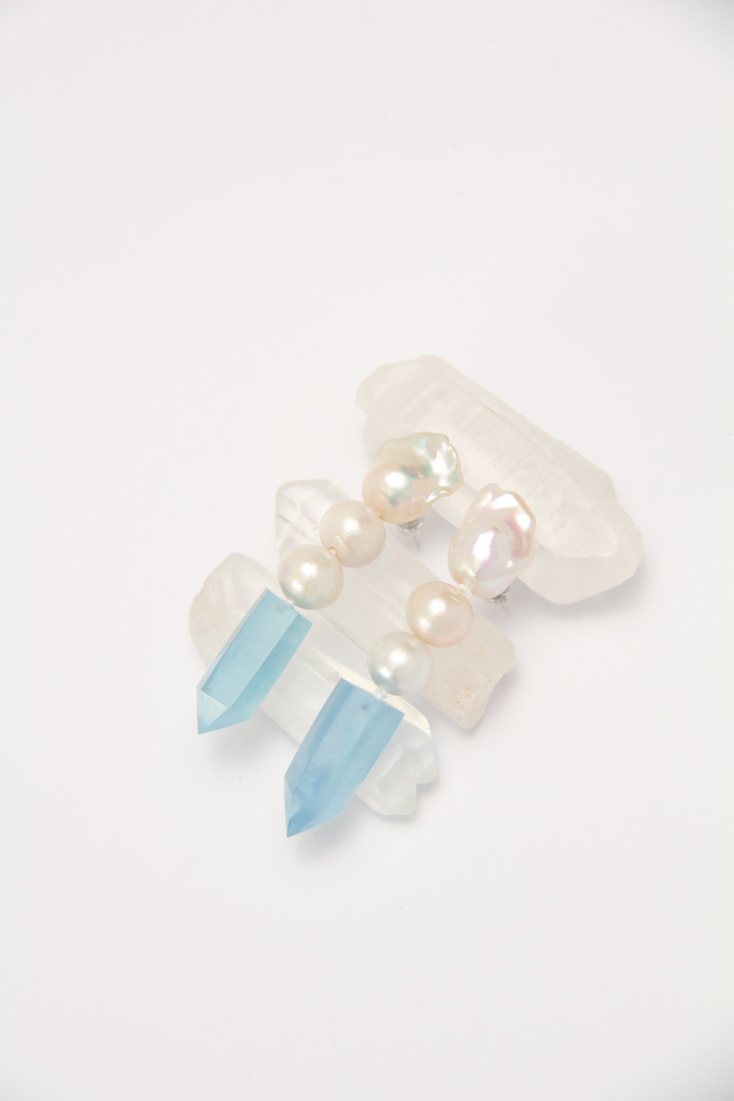 Earrings: pearls, aquamarine