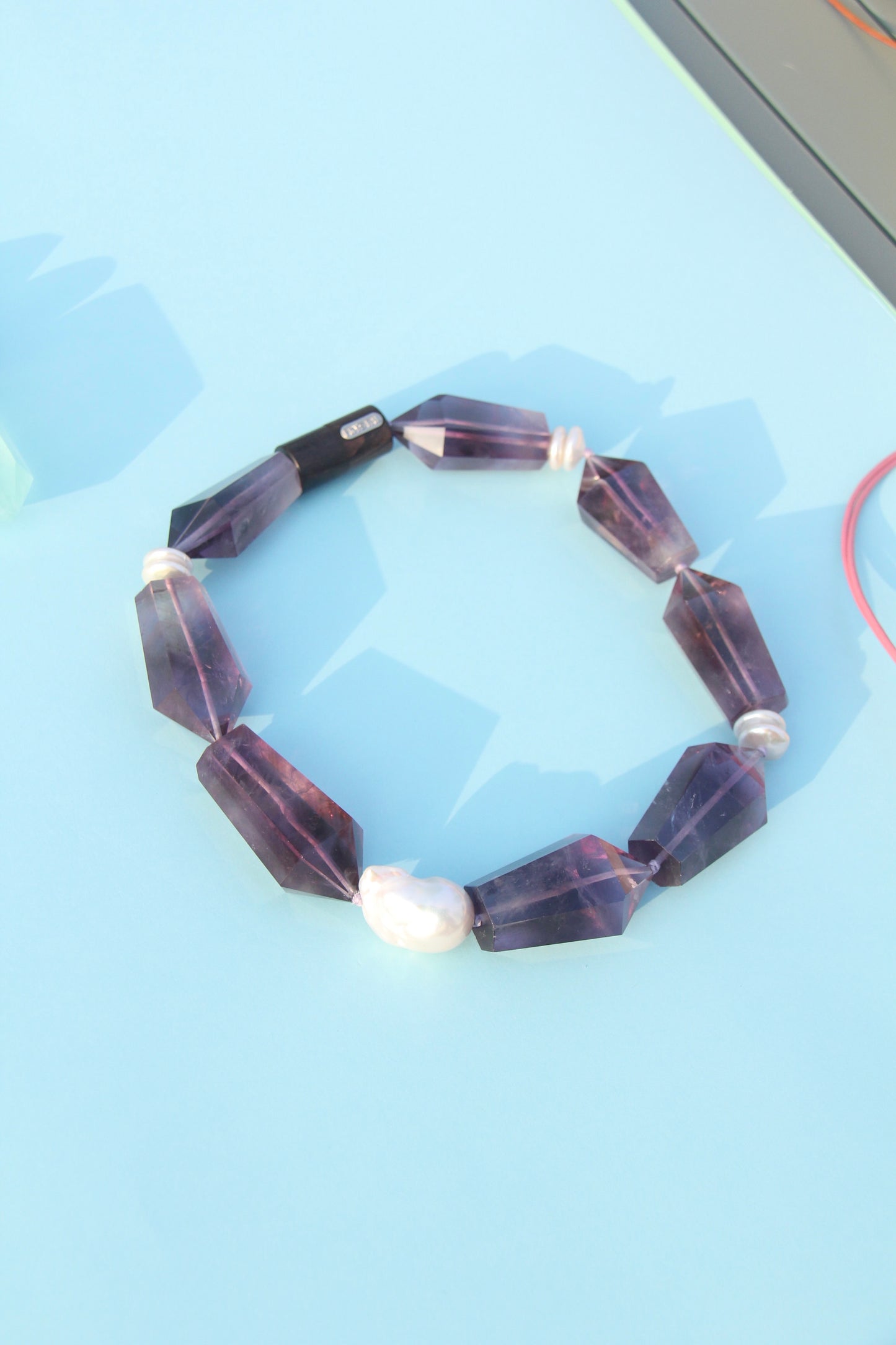 Necklace: pearls, amethyst, ebony