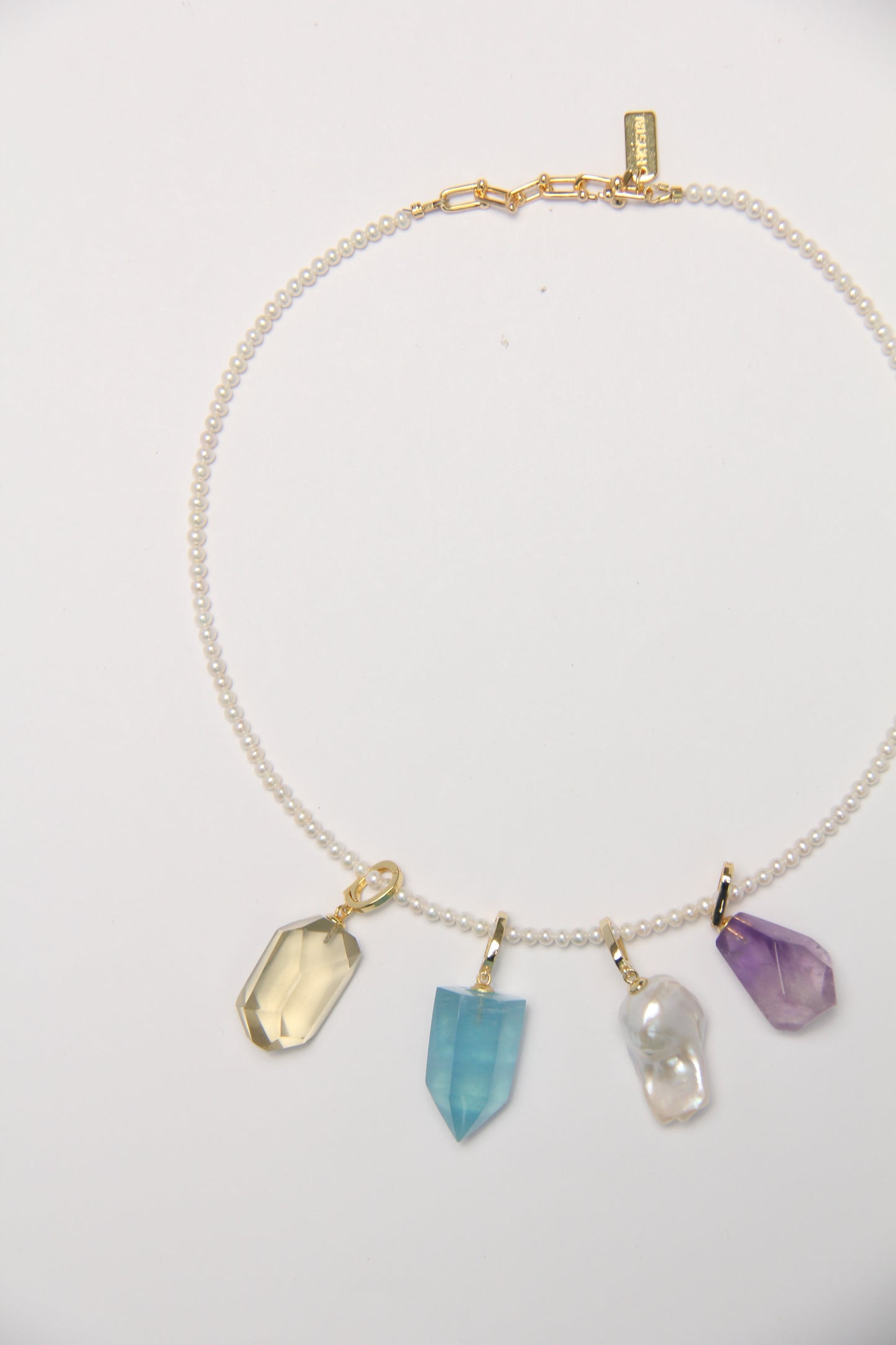 Charms: citrine, aquamarine, pearls, amethyst