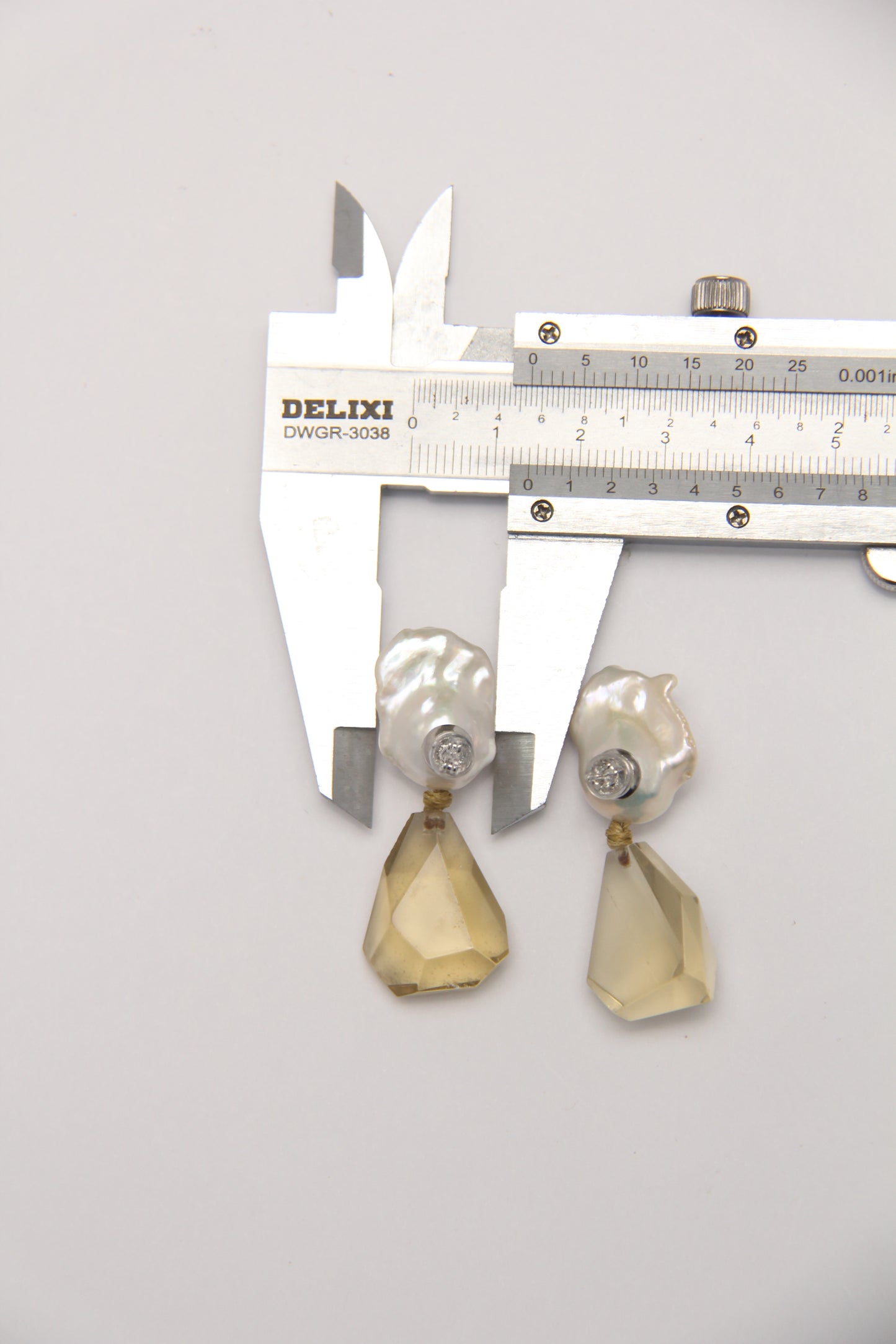 Earrings: pearls, citrine