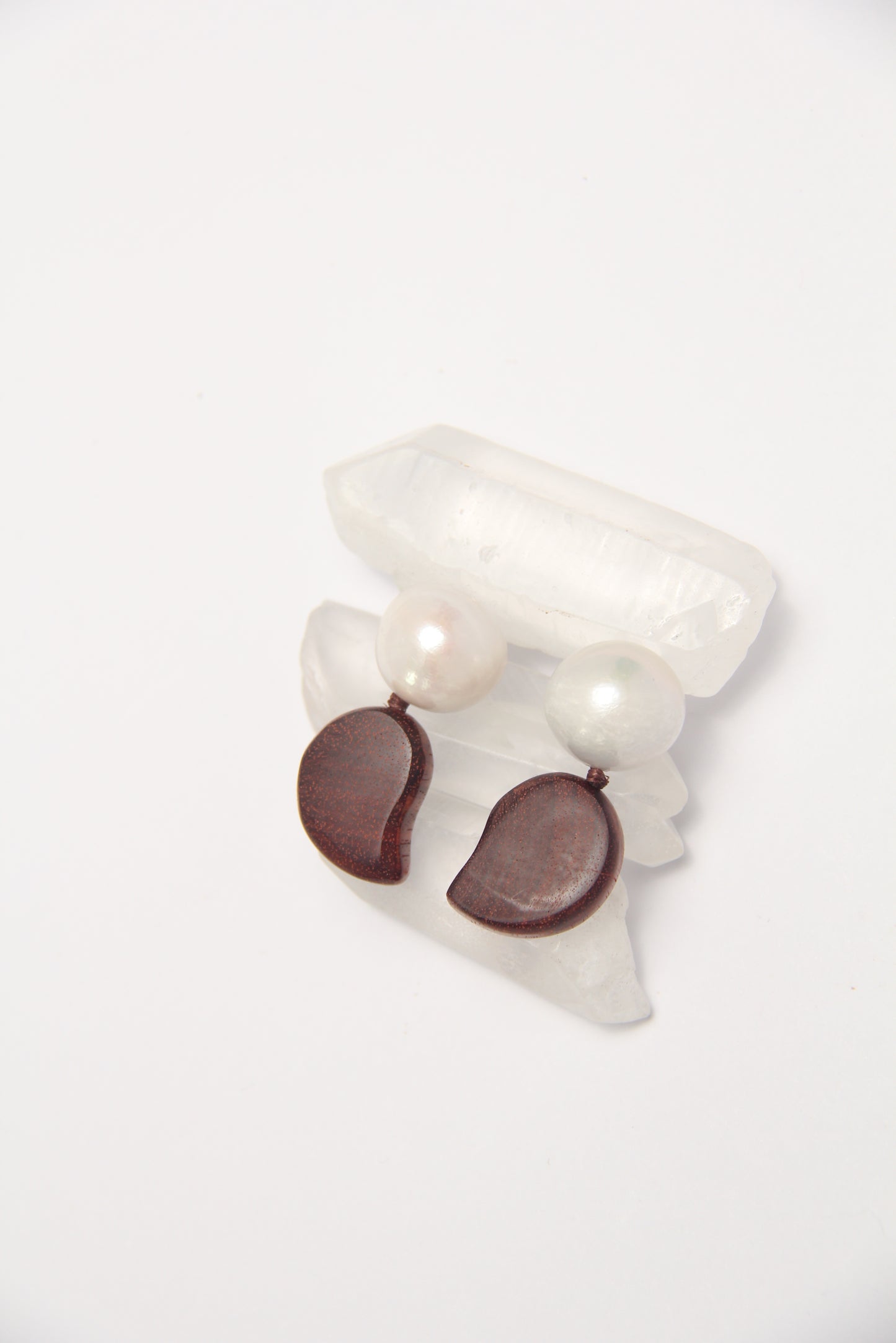Earrings: pearls, zambia rosewood