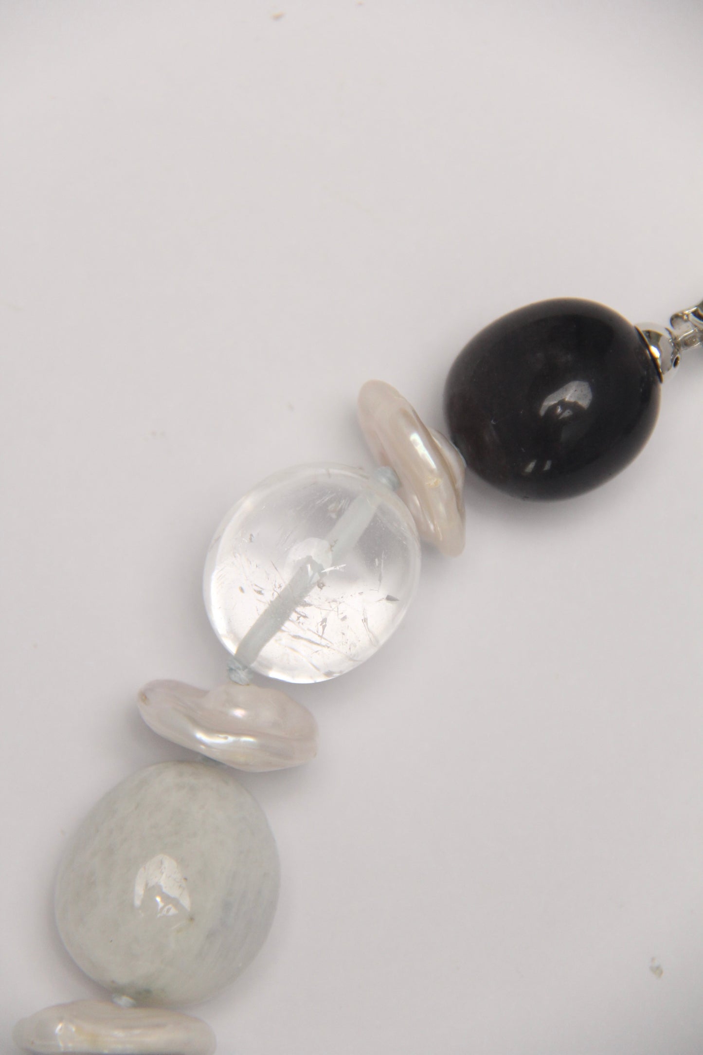 Necklace: herkimer diamond, kiwi stone, obsidian, quartz, moonstone, titanium magnet