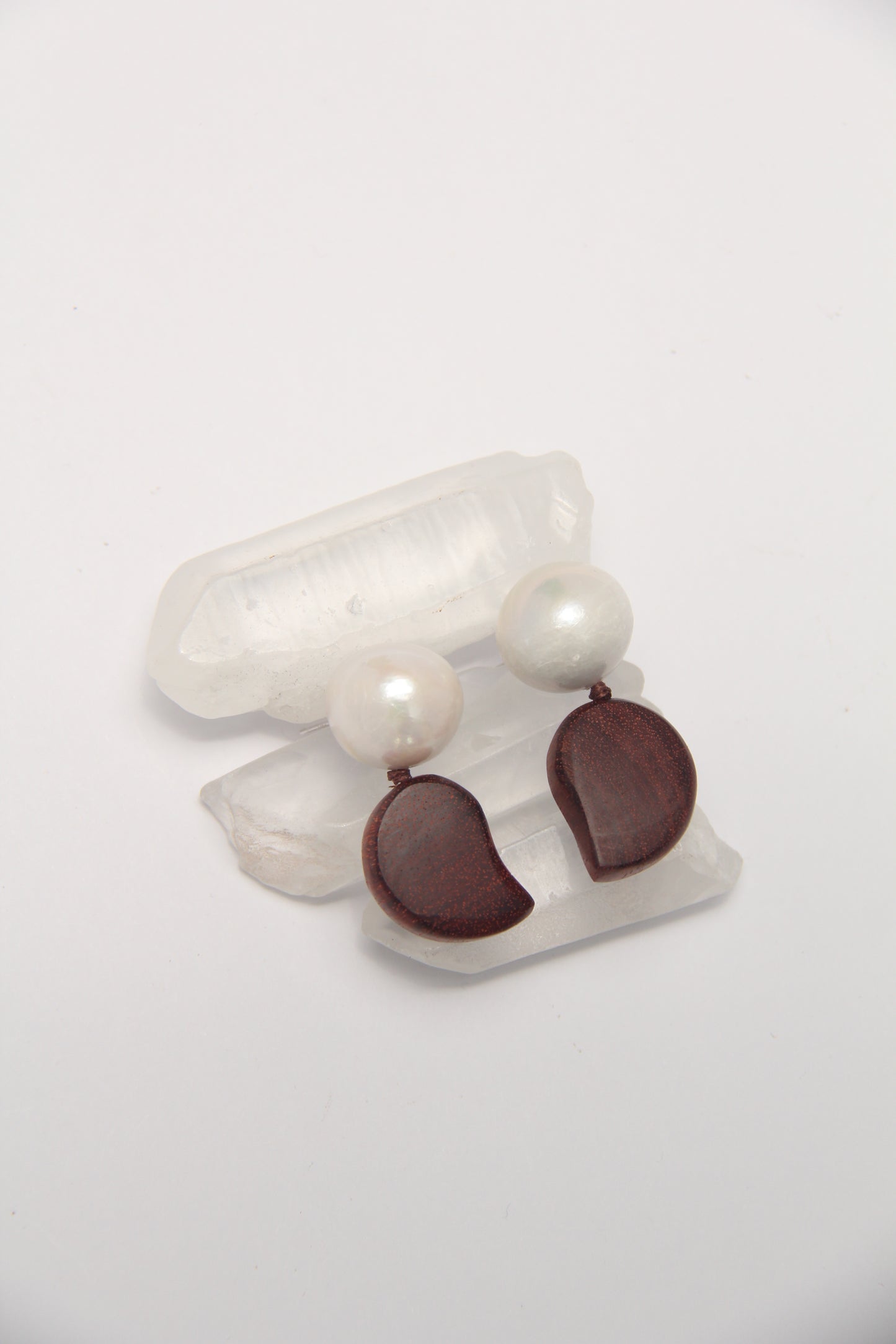 Earrings: pearls, zambia rosewood