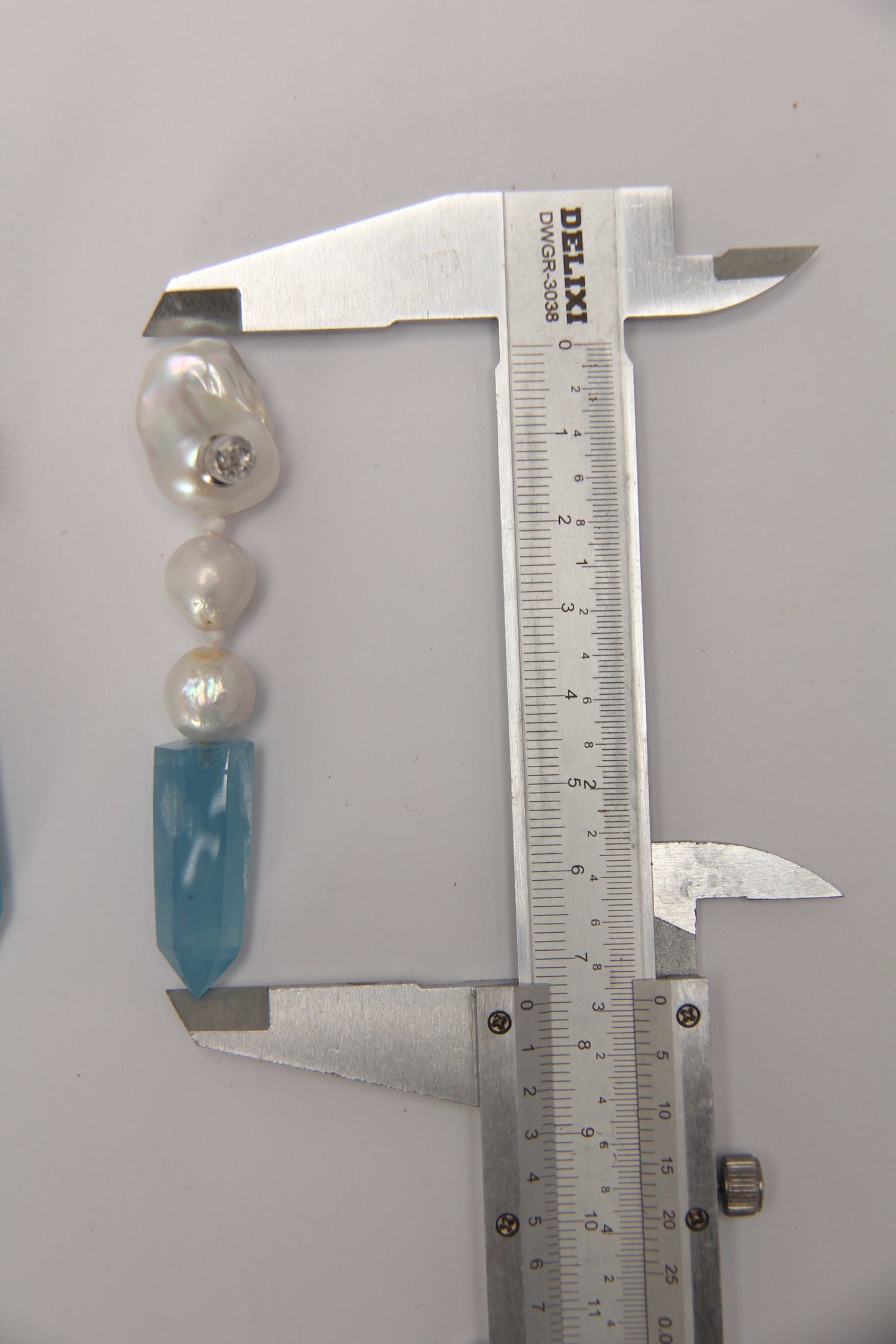 Earrings: pearls, aquamarine