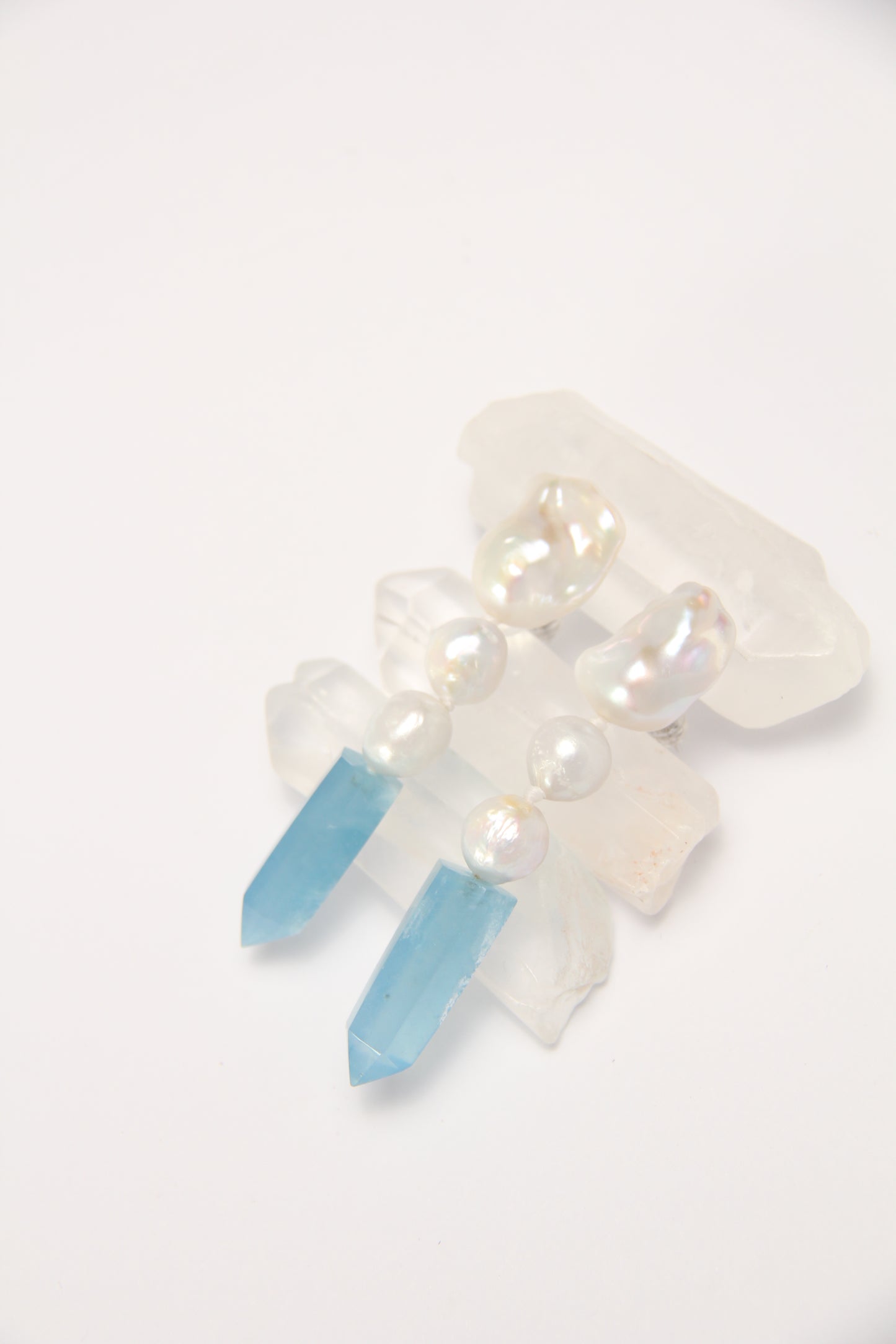 Earrings: pearls, aquamarine