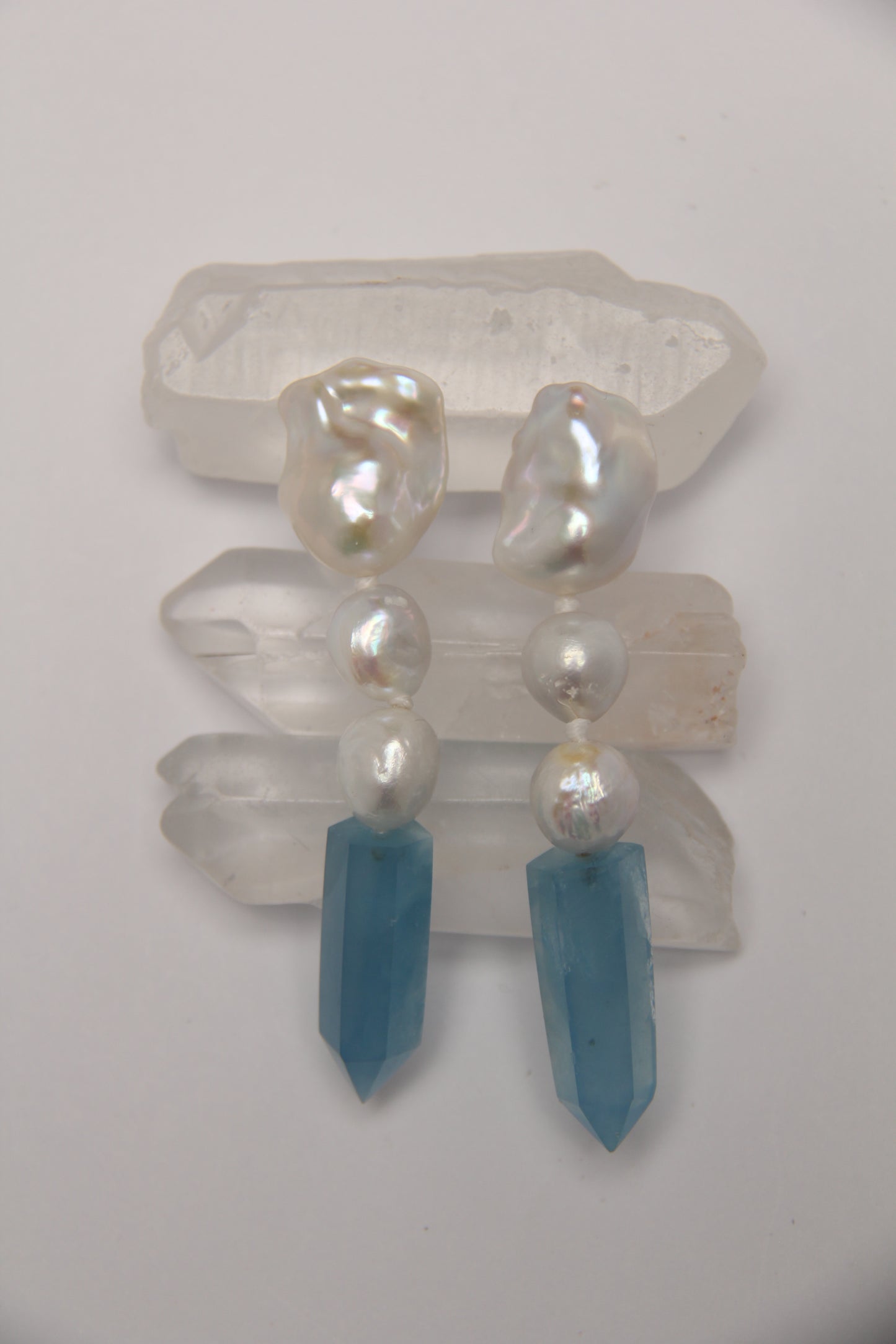 Earrings: pearls, aquamarine