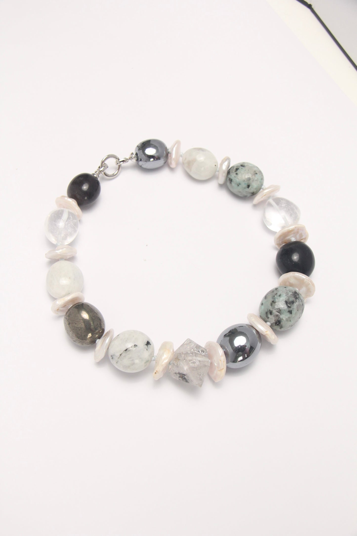 Necklace: herkimer diamond, kiwi stone, obsidian, quartz, moonstone, titanium magnet
