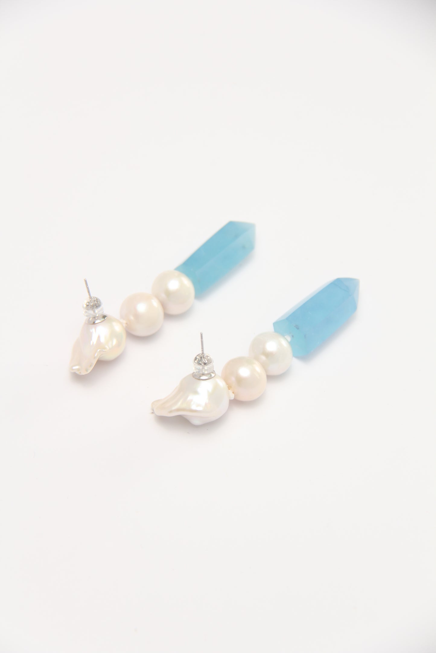 Earrings: pearls, aquamarine