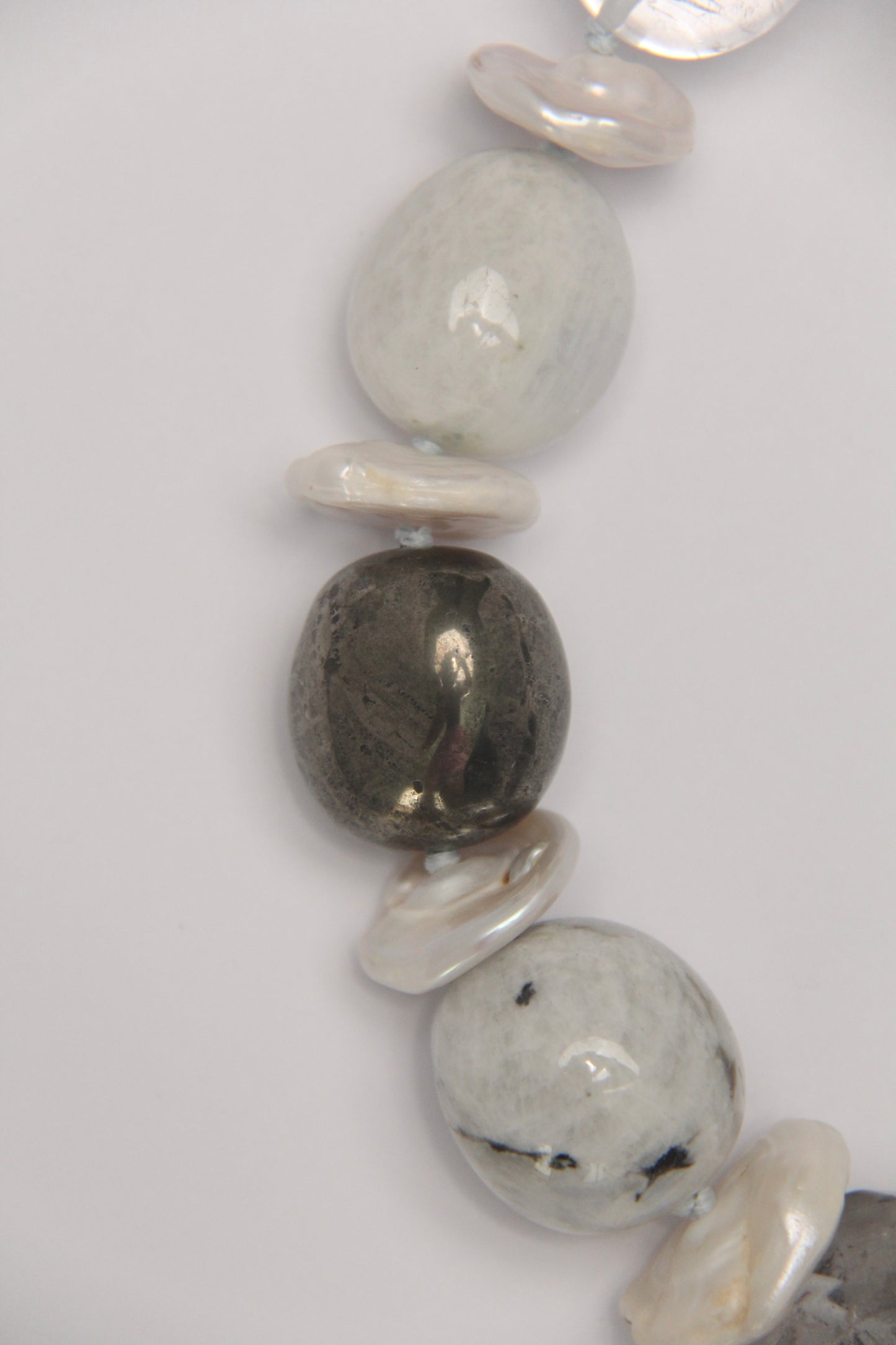 Necklace: herkimer diamond, kiwi stone, obsidian, quartz, moonstone, titanium magnet