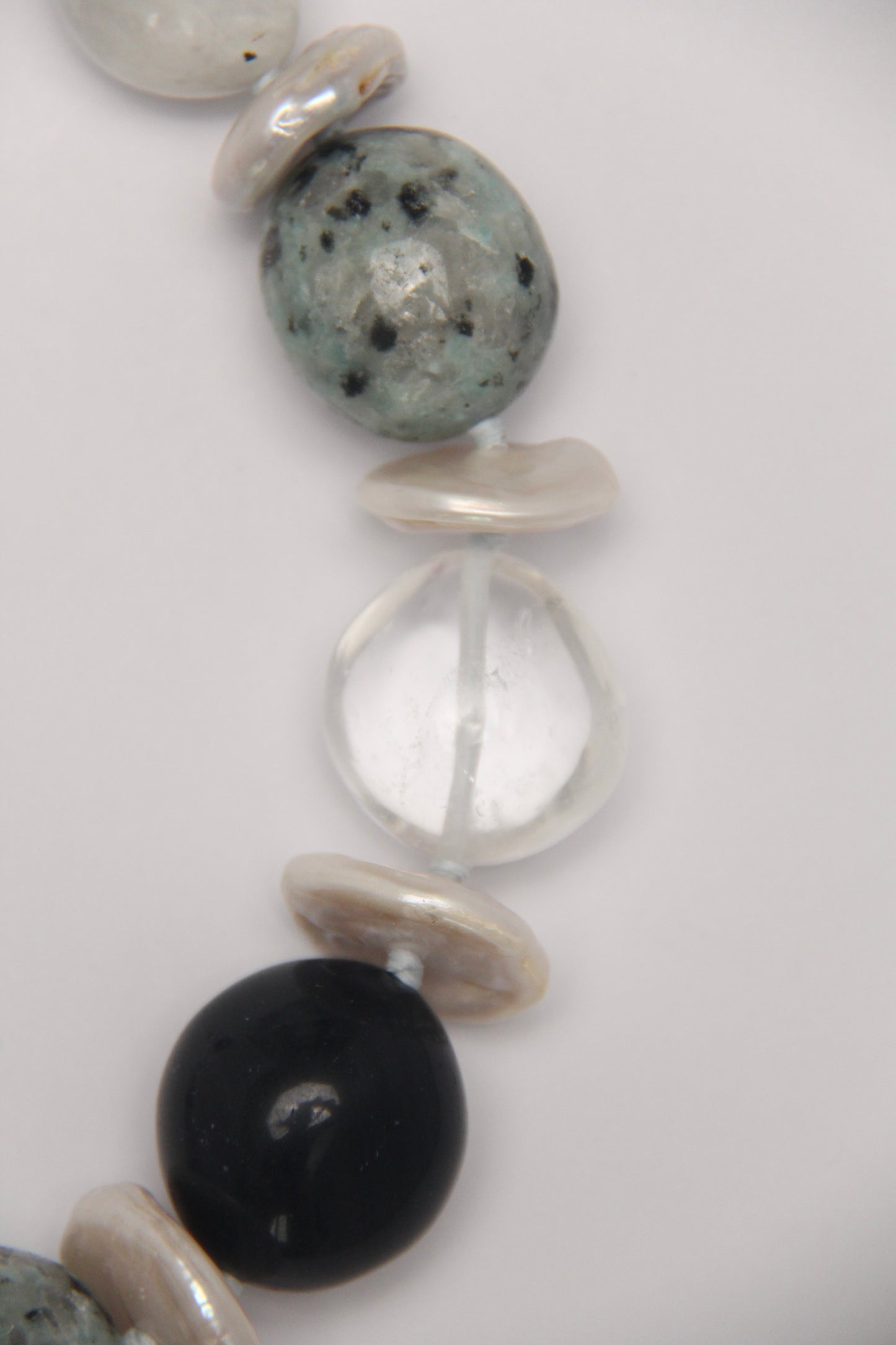 Necklace: herkimer diamond, kiwi stone, obsidian, quartz, moonstone, titanium magnet