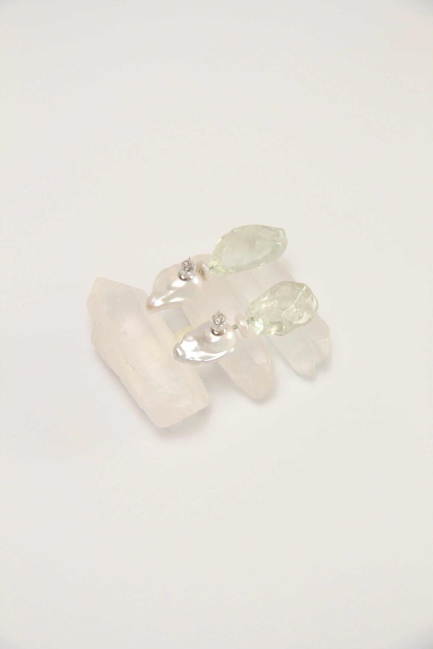Earrings: pearls, prasem quartz