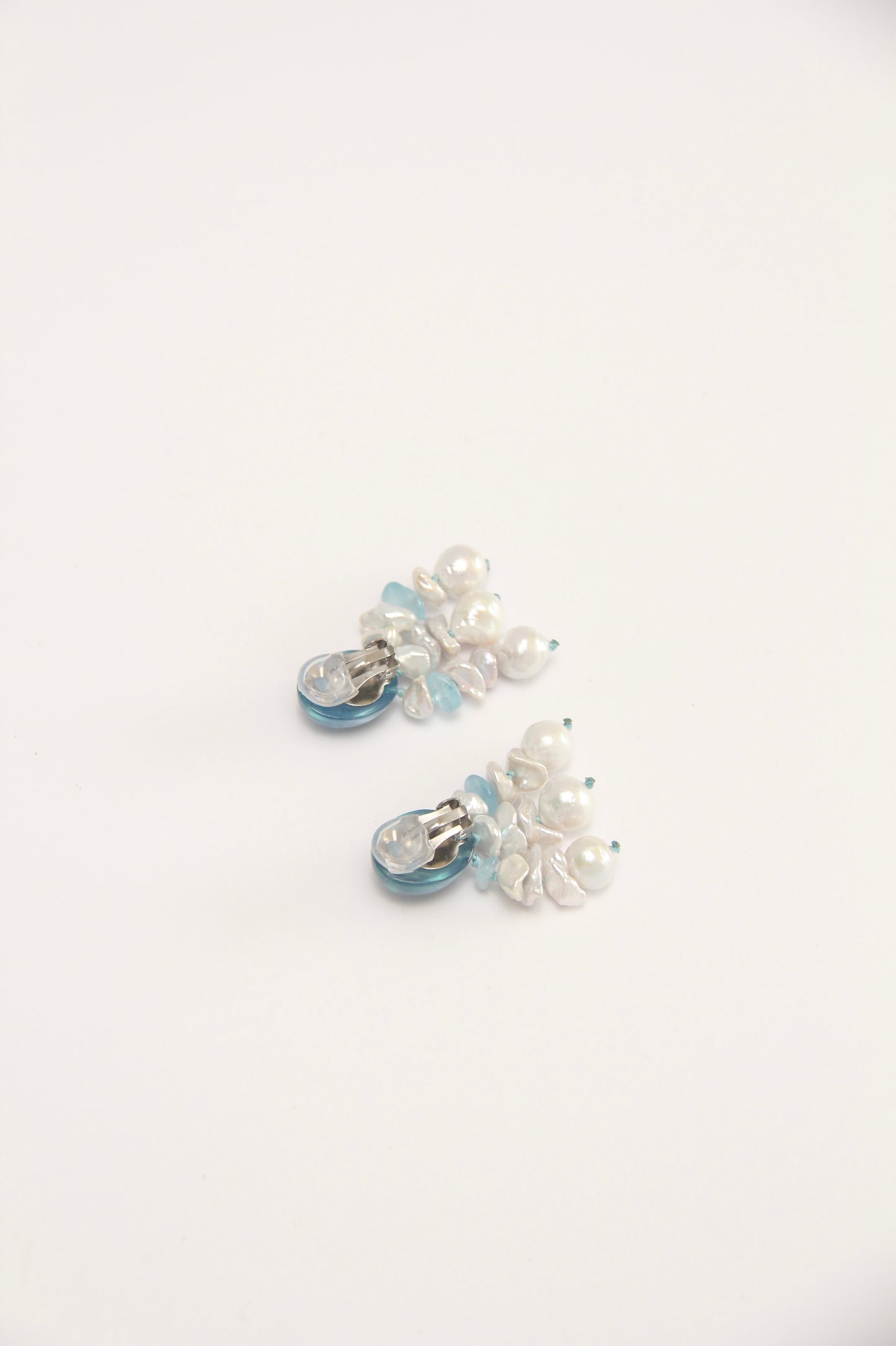 Earrings: pearls, aquamarine