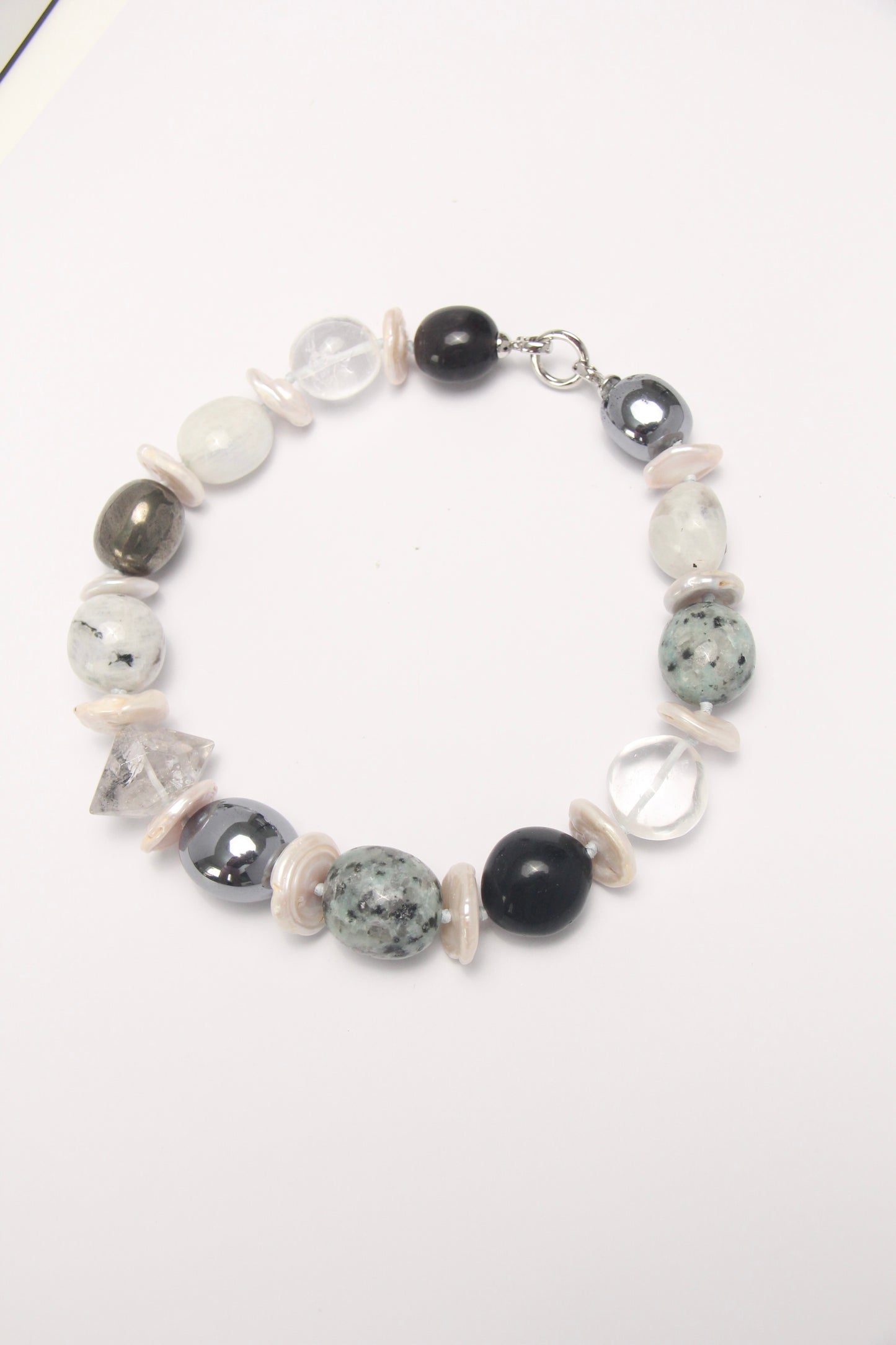 Necklace: herkimer diamond, kiwi stone, obsidian, quartz, moonstone, titanium magnet