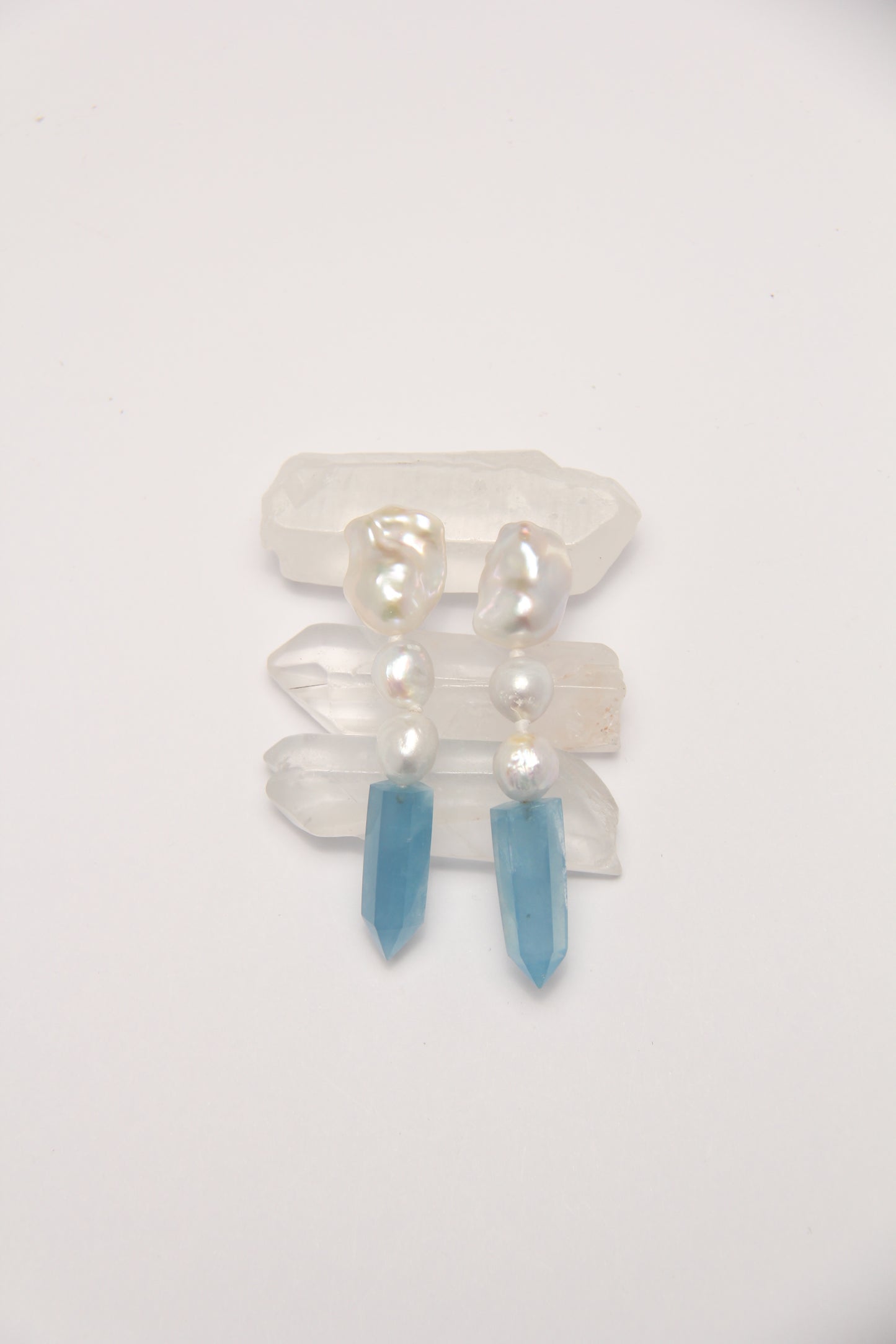Earrings: pearls, aquamarine