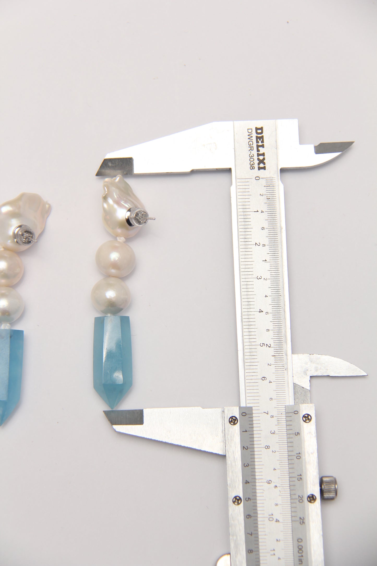 Earrings: pearls, aquamarine