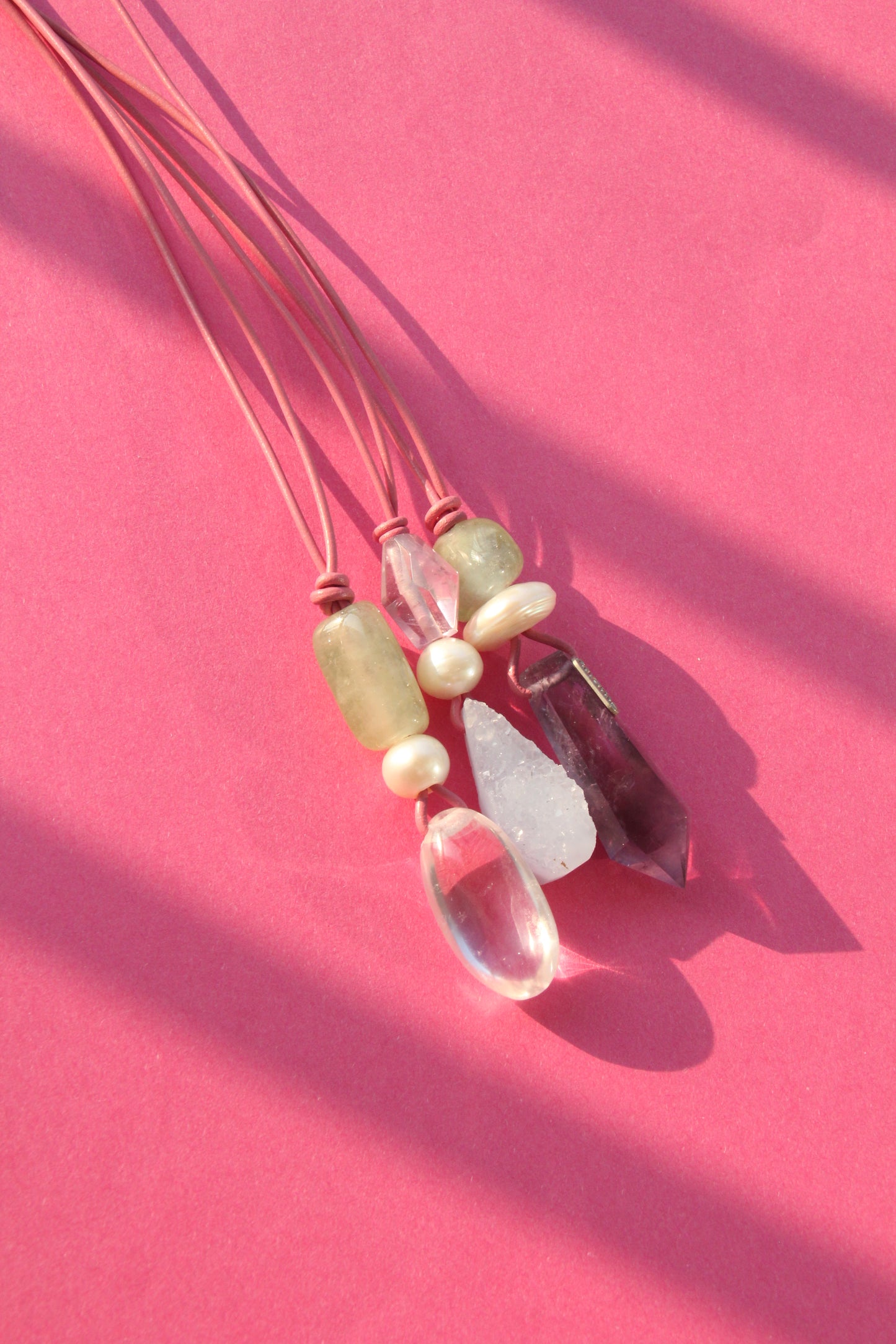 Pendant: morganite, pearl, amethyst, leather