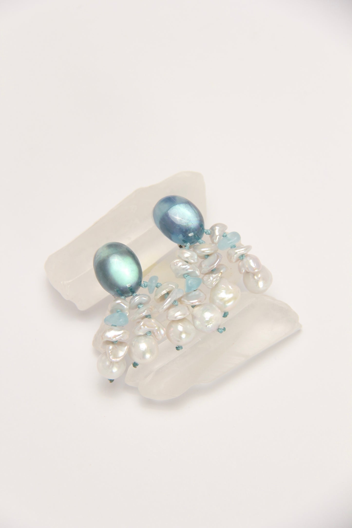 Earrings: pearls, aquamarine