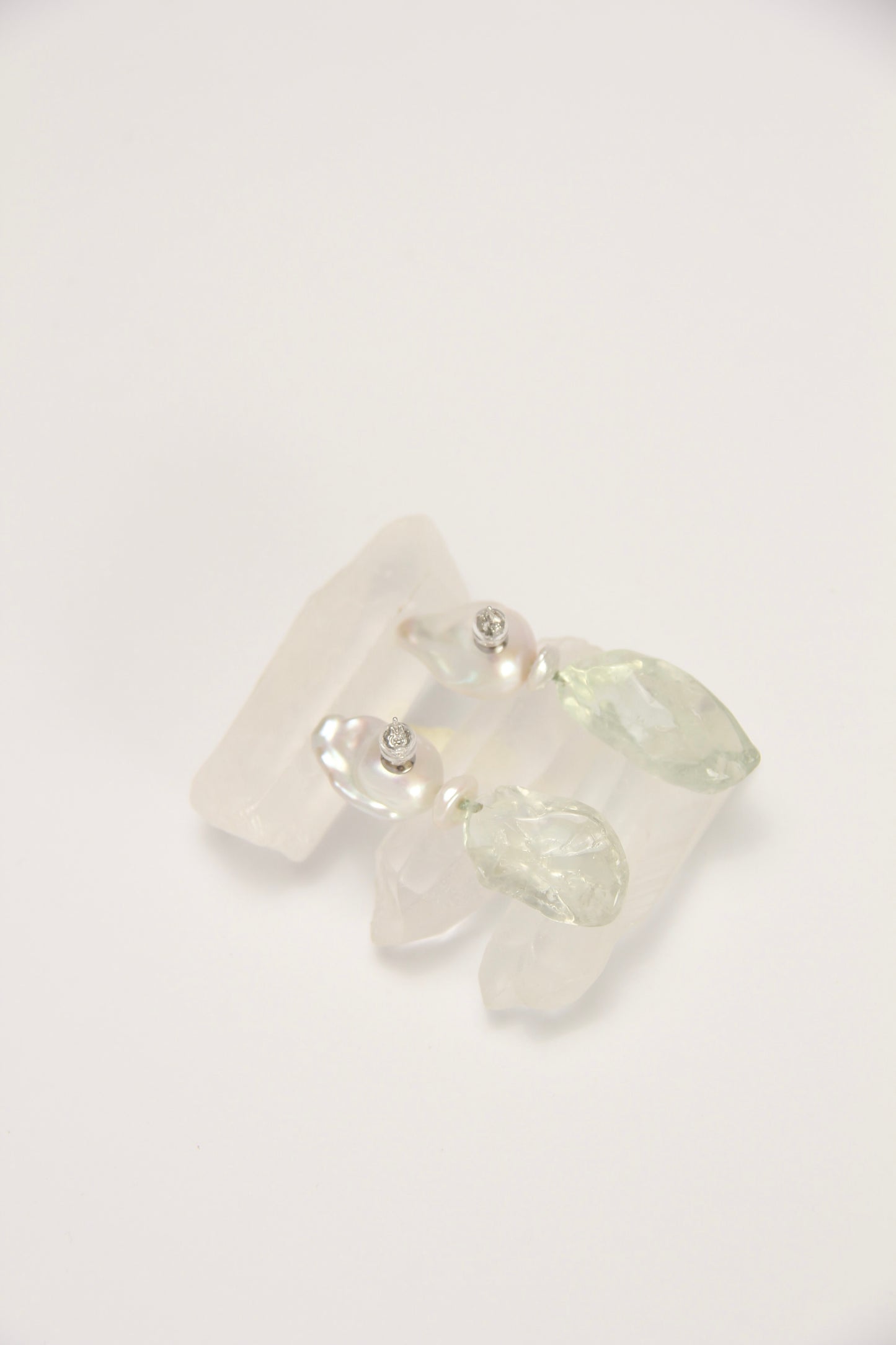 Earrings: pearls, prasem quartz
