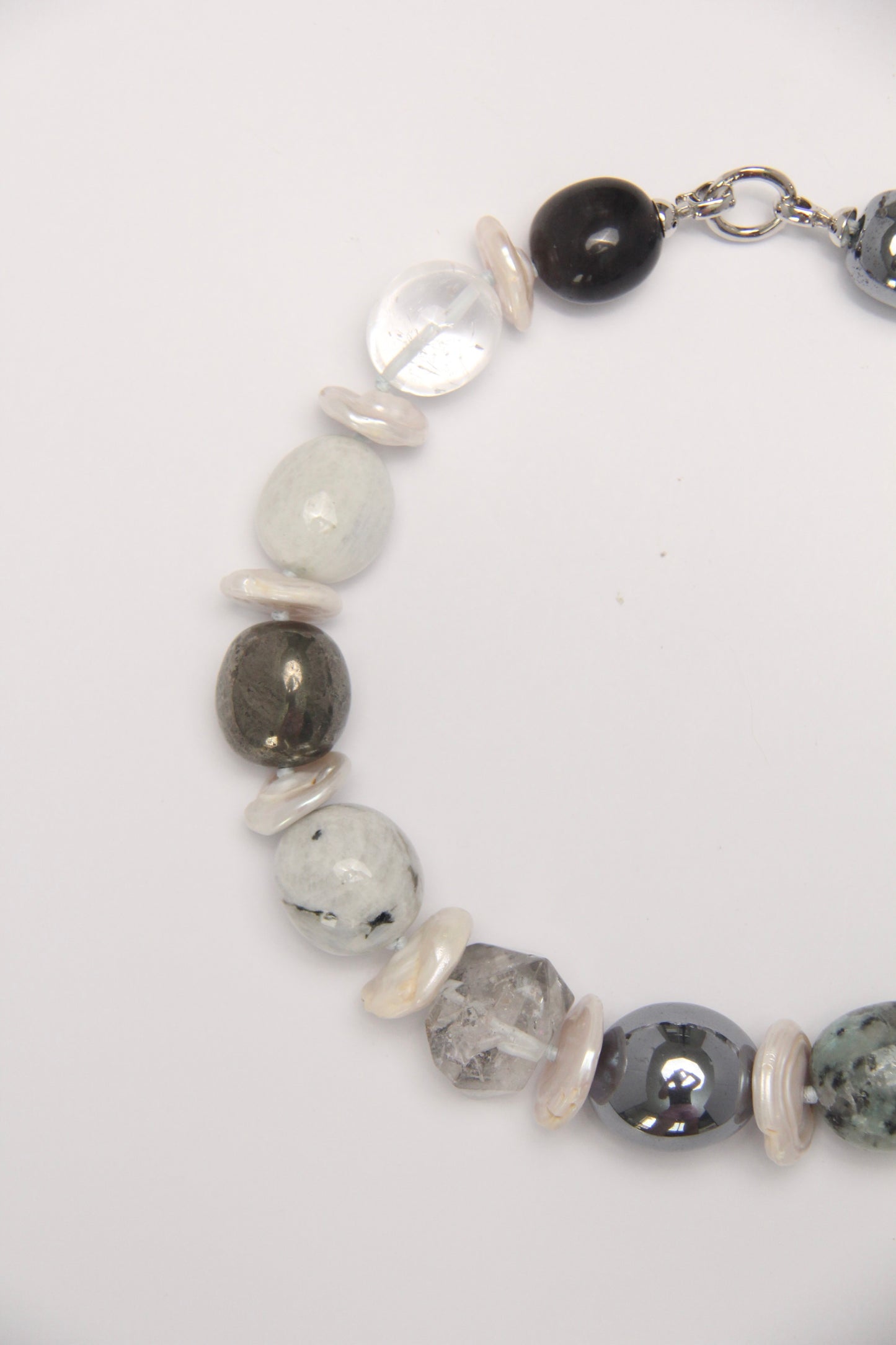 Necklace: herkimer diamond, kiwi stone, obsidian, quartz, moonstone, titanium magnet