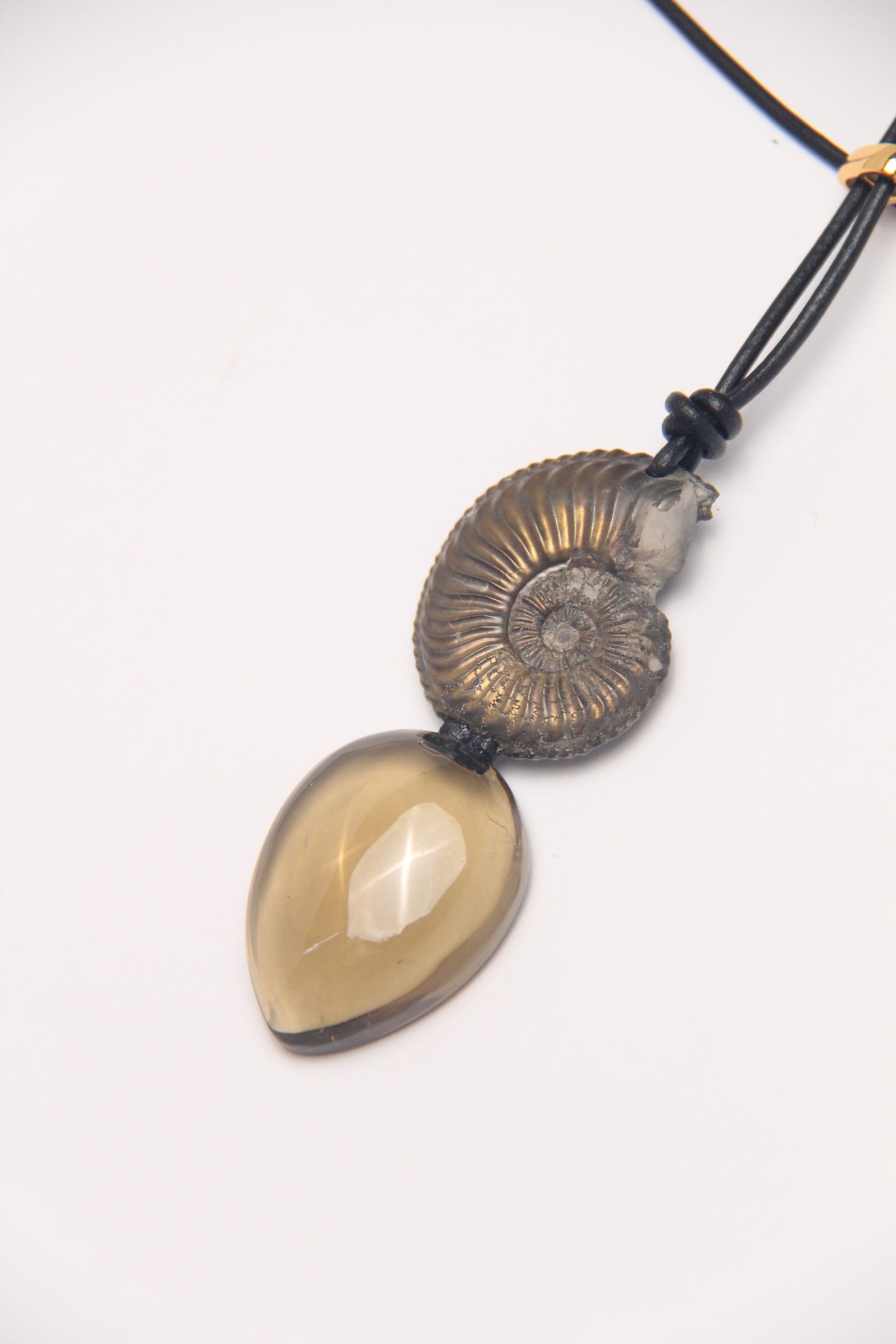 Pendant: ammonite fossil, citrine, leather