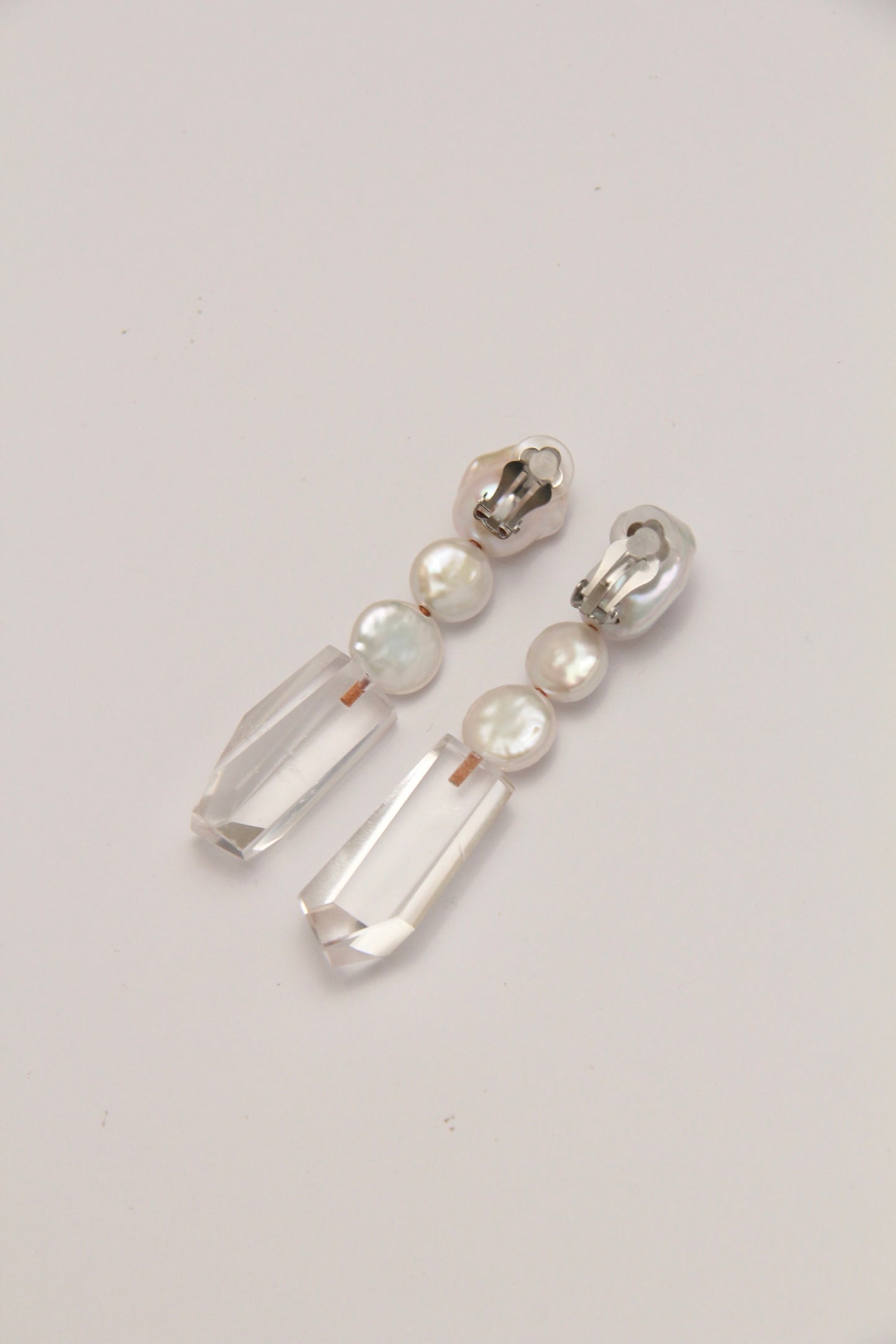 Earrings: pearls, quartz