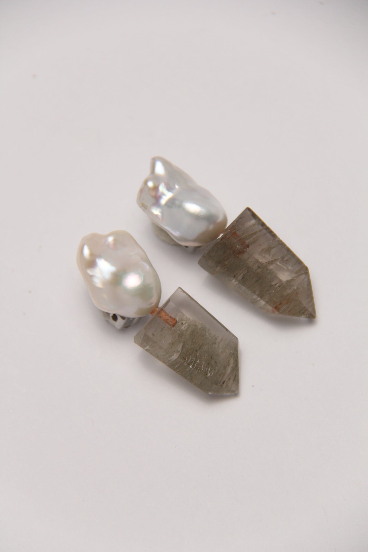Earrings: pearls, phantom quartz