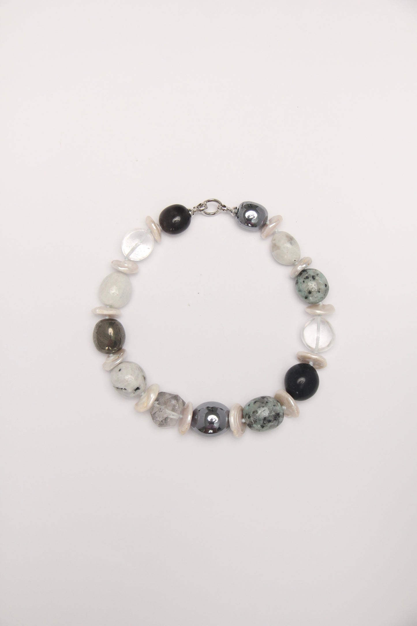 Necklace: herkimer diamond, kiwi stone, obsidian, quartz, moonstone, titanium magnet