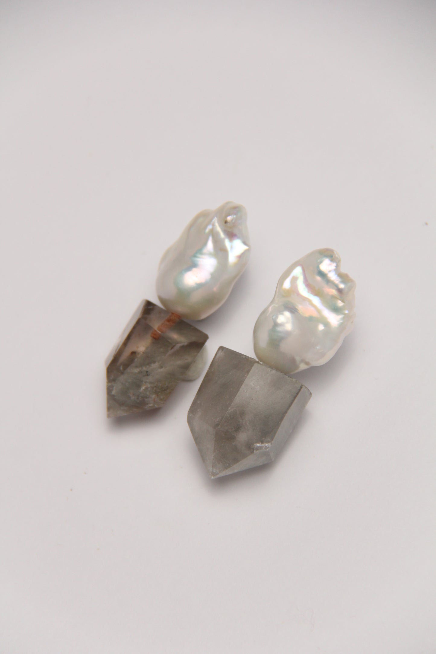 Earrings: pearls, phantom quartz