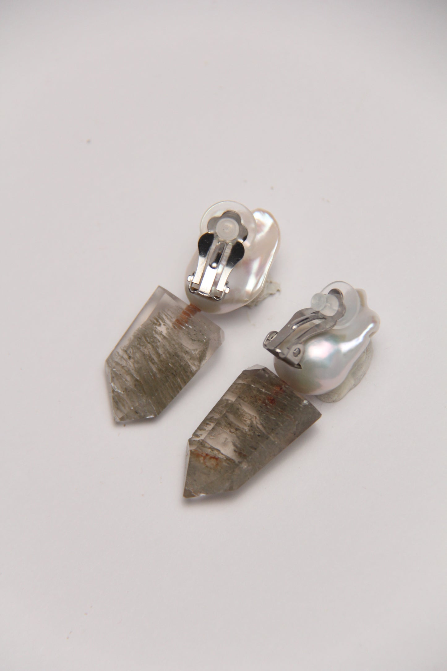 Earrings: pearls, phantom quartz