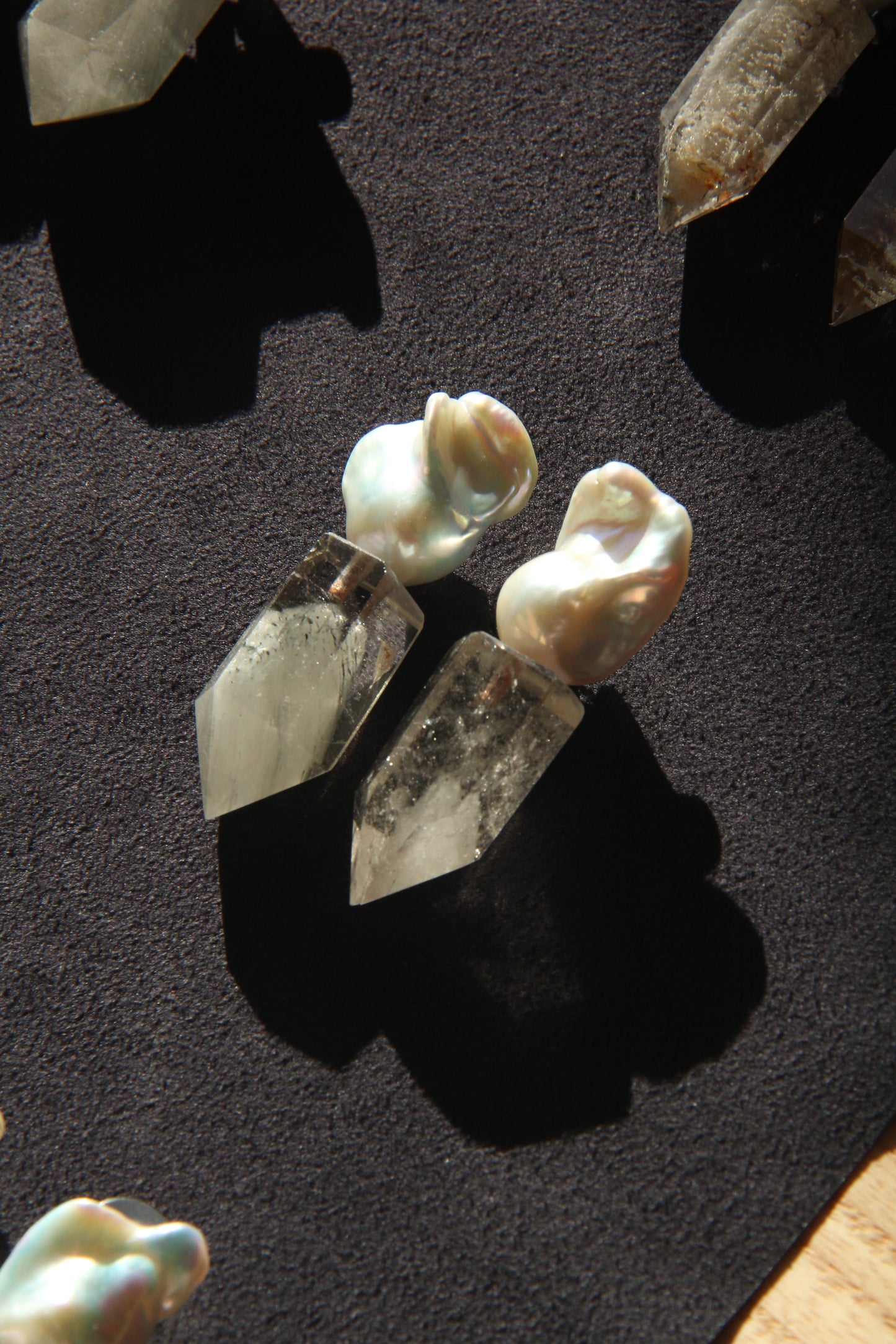 Earrings: pearls, phantom quartz