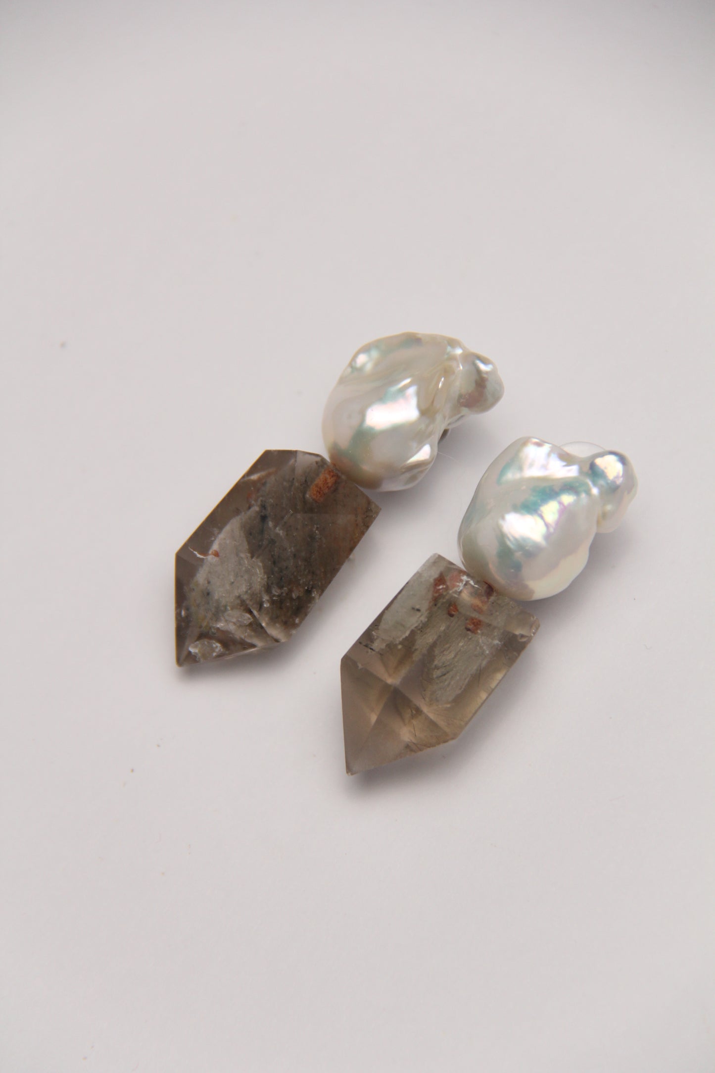 Earrings: pearls, phantom quartz