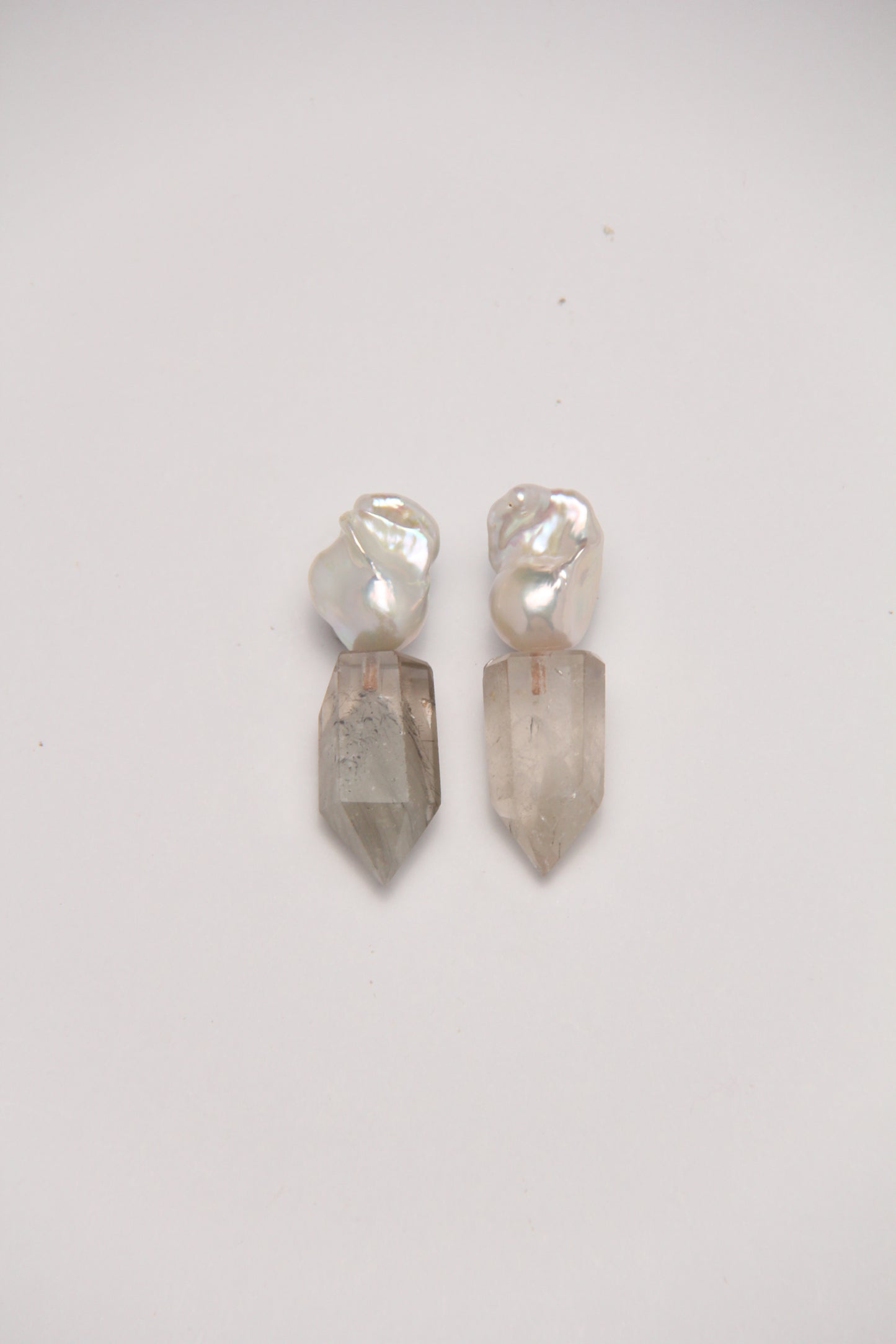 Earrings: pearls, phantom quartz