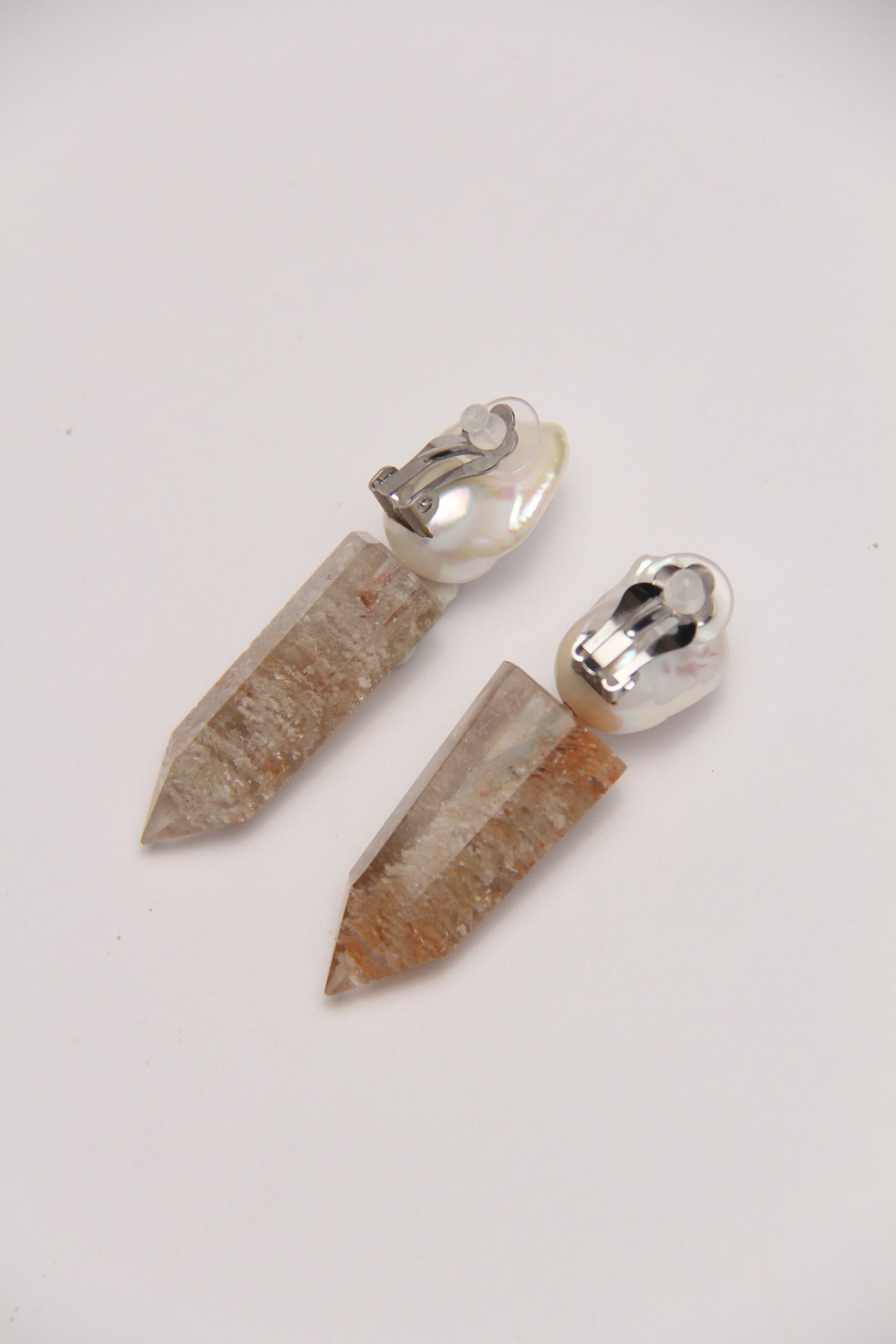 Earrings: pearls, phantom quartz